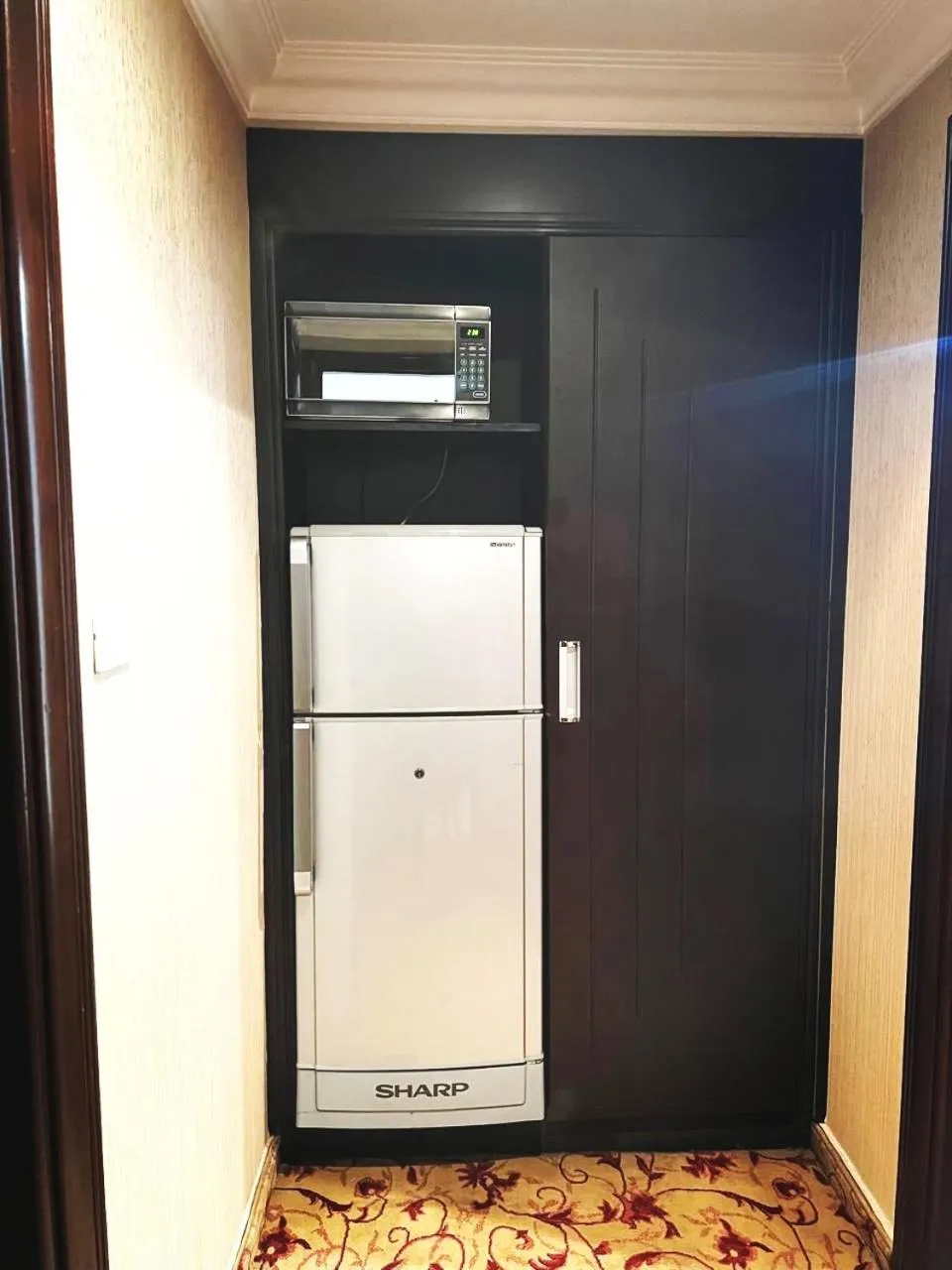 Kitchen or kitchenette in Queens Suite Hotel