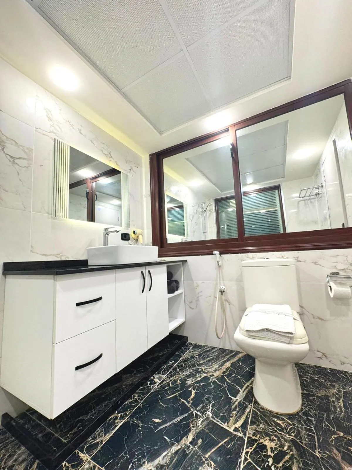 Bathroom in Queens Suite Hotel