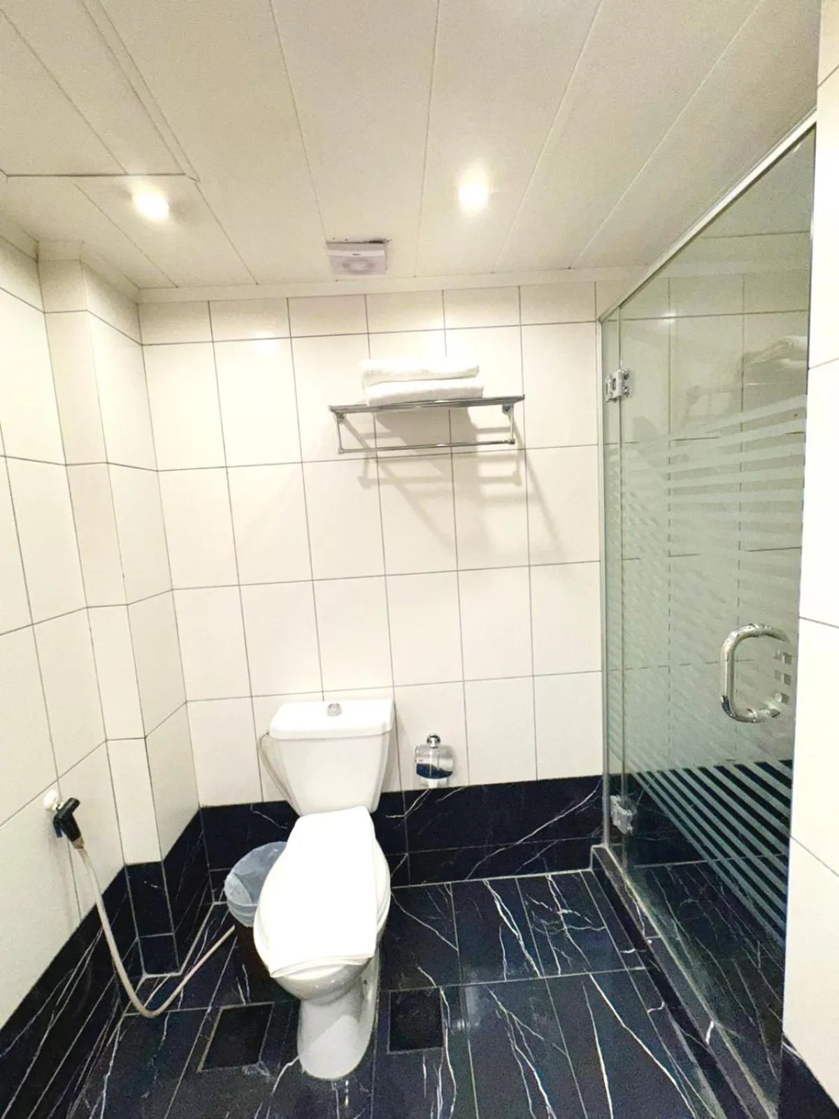 Bathroom in Queens Suite Hotel