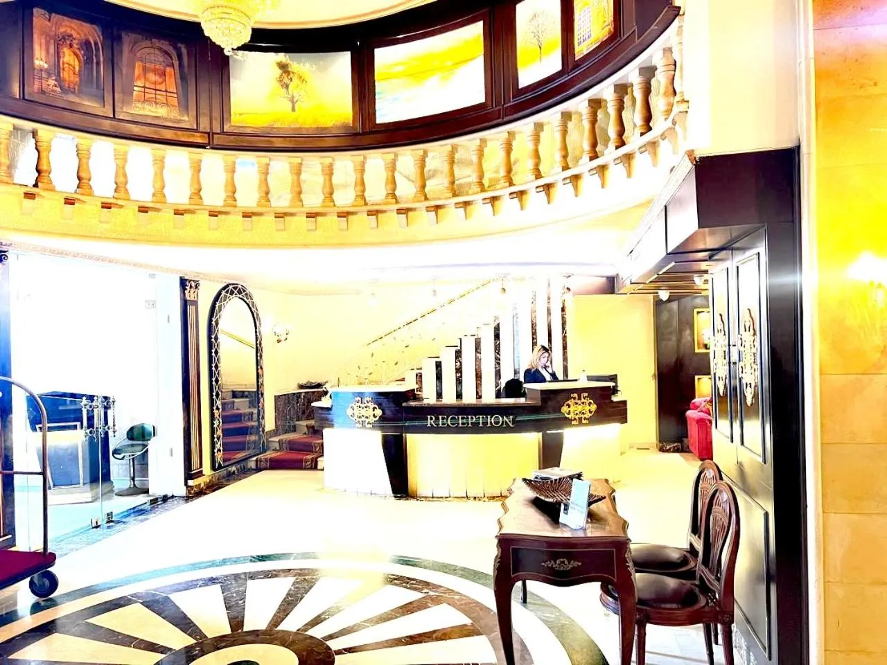 Lobby or reception in Queens Suite Hotel