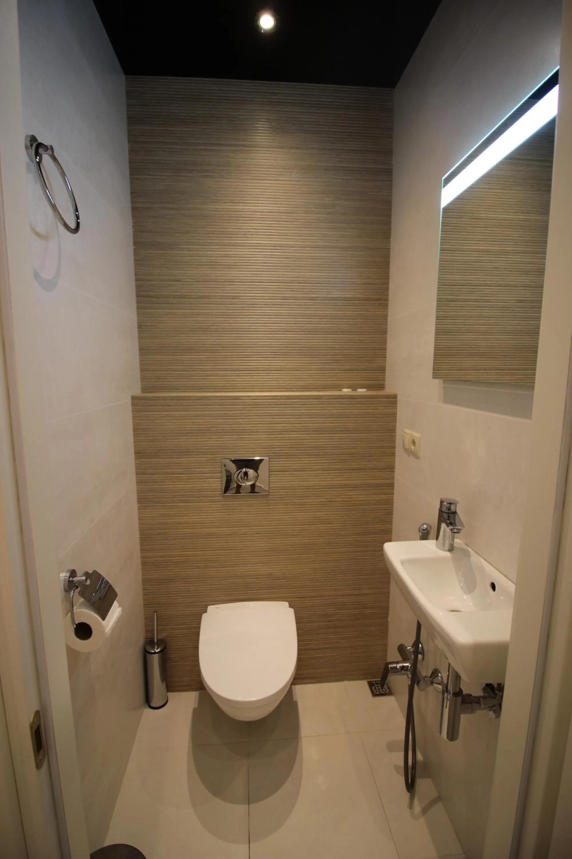 Toilet in Superior Apartments