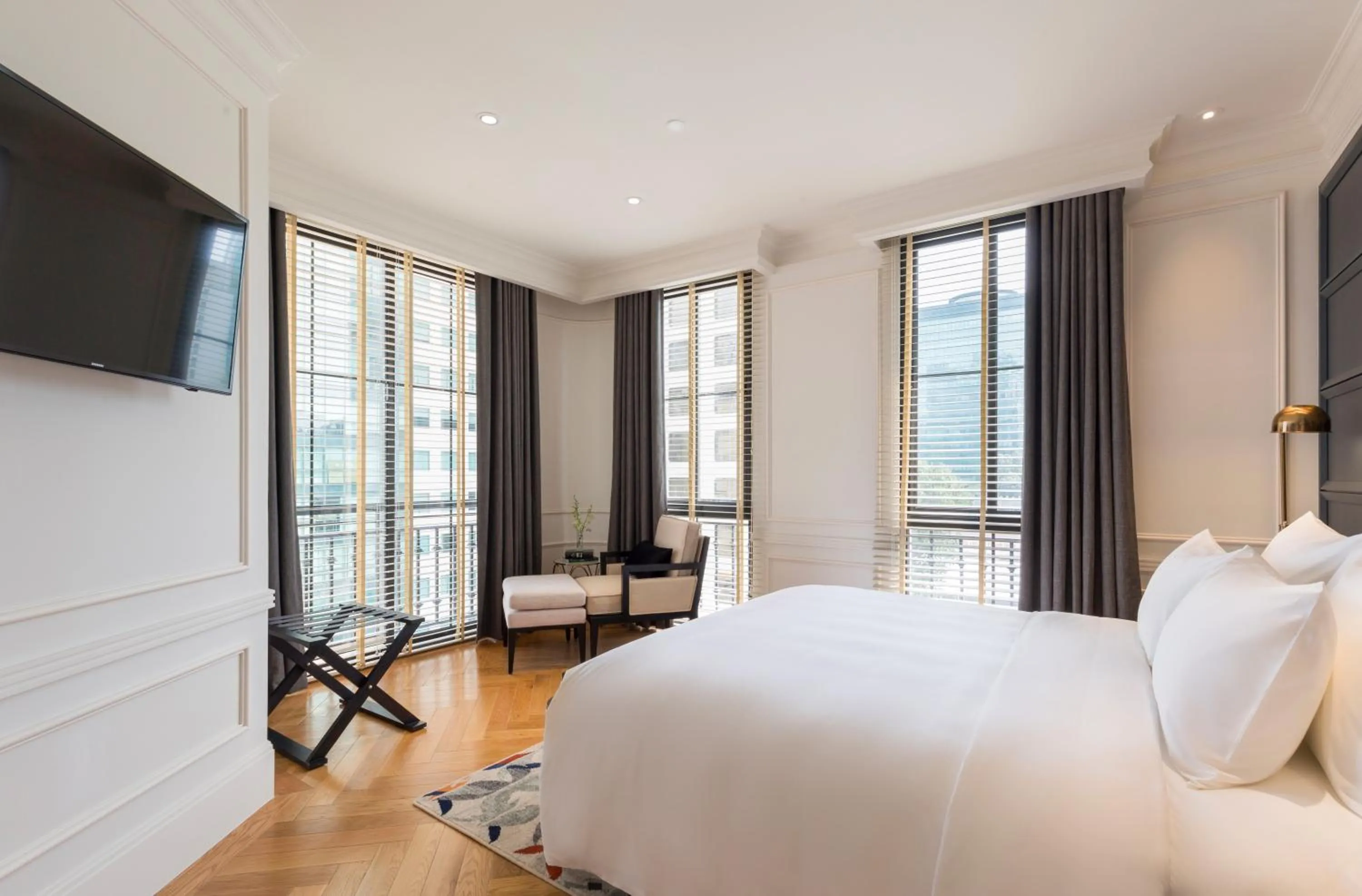 Bed in Bach Suites Saigon, a Member of Design Hotels