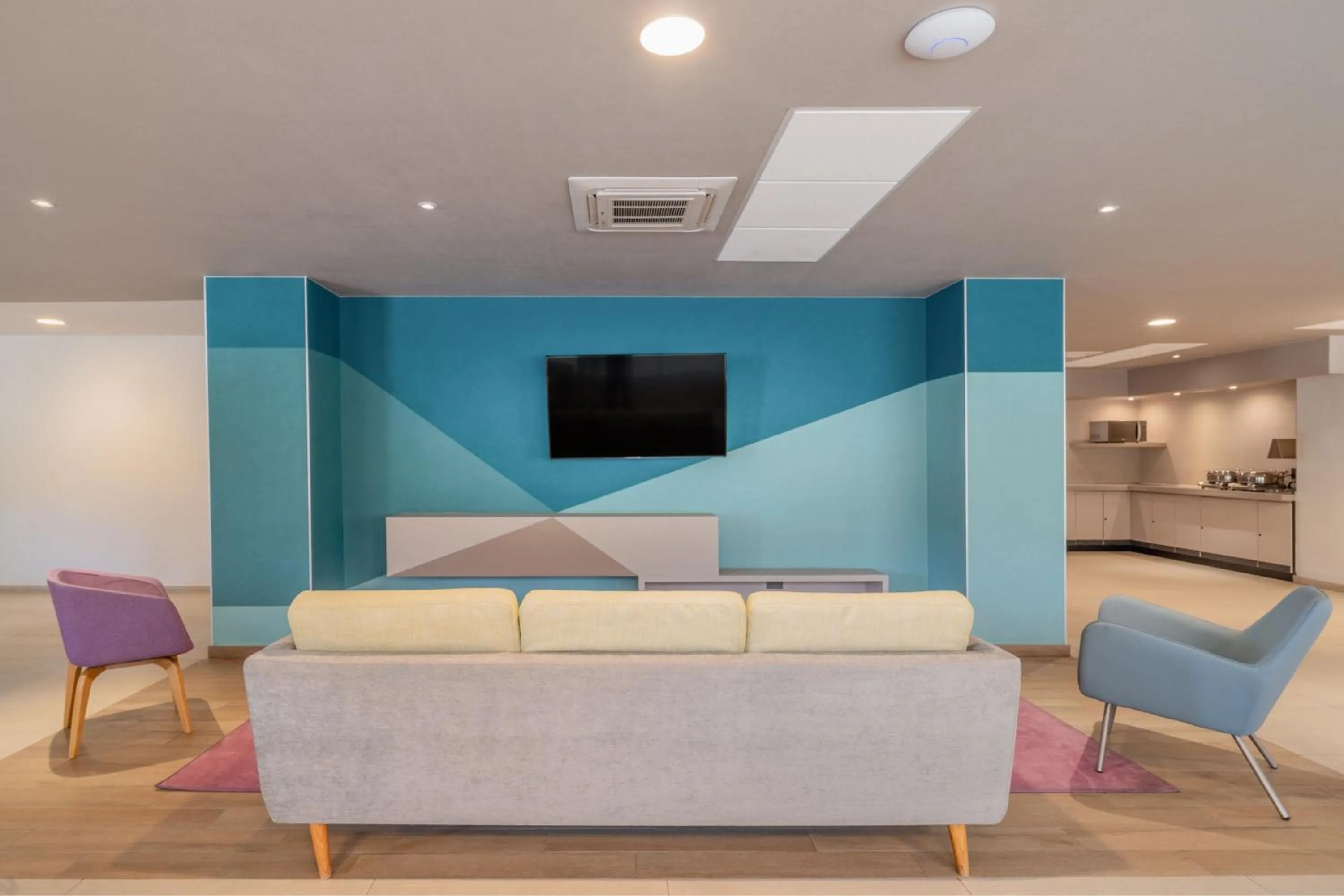 Lobby or reception in City Express Suites by Marriott Queretaro