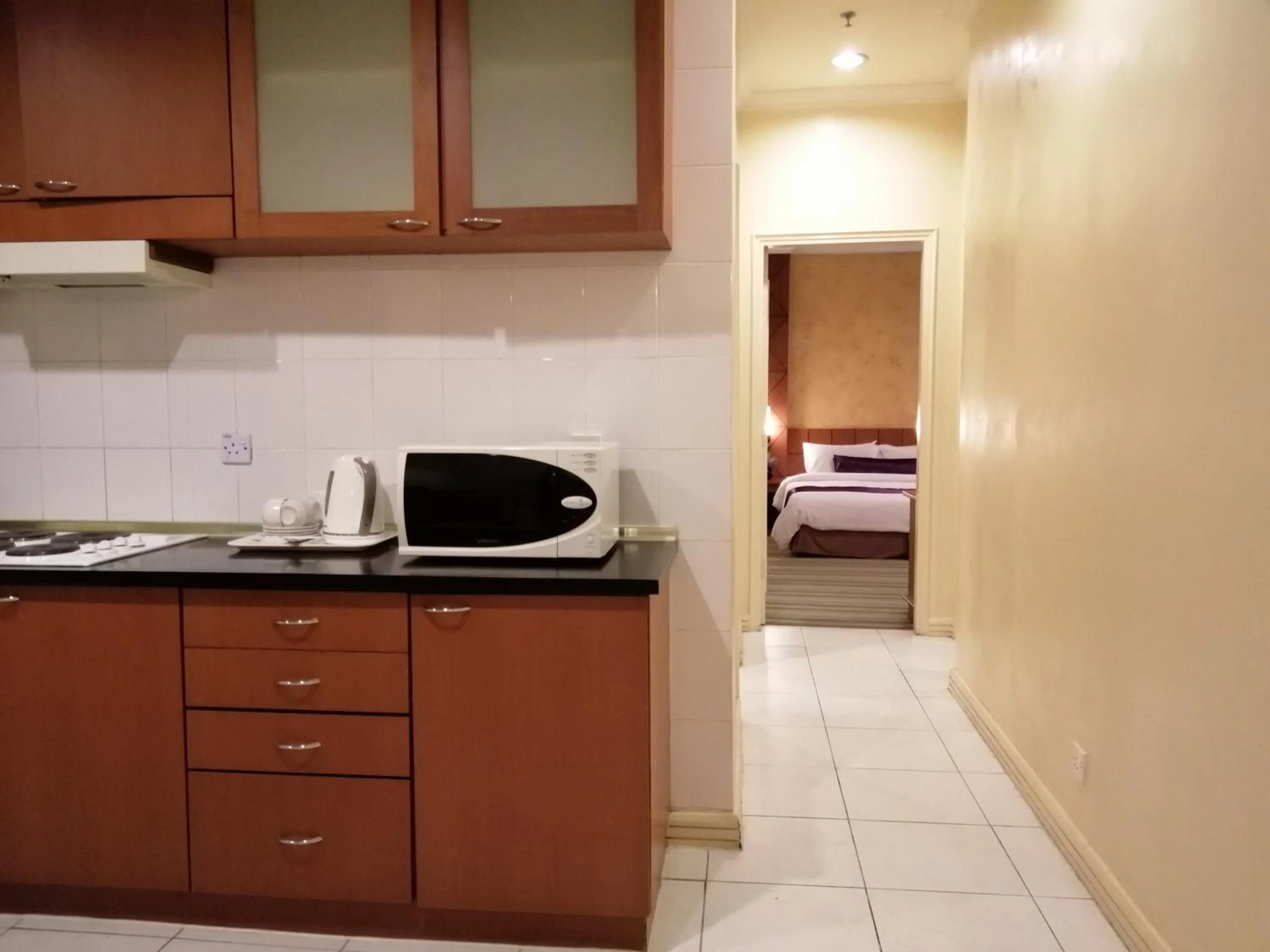 Coffee/tea facilities, Bed in StayInn Gateway Hotel Apartment