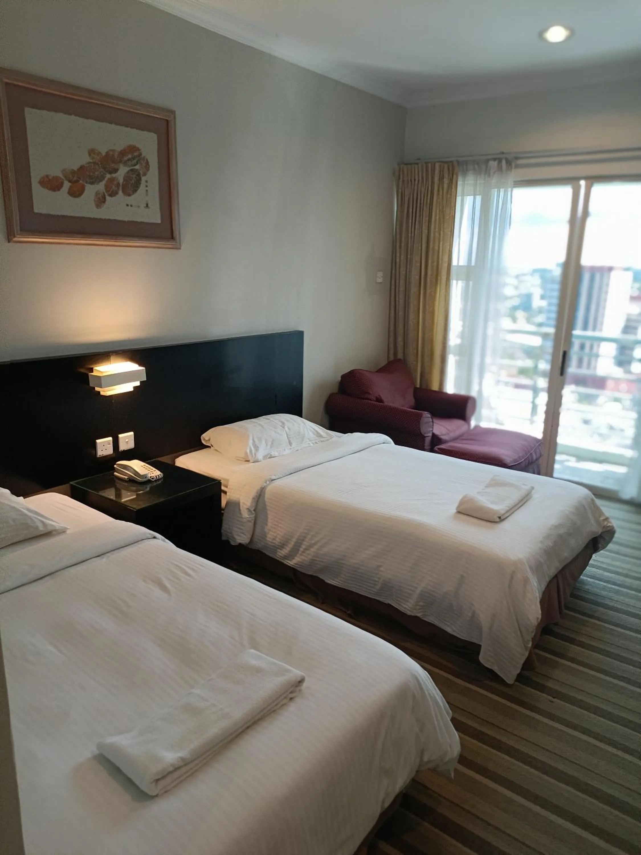 Bed in StayInn Gateway Hotel Apartment