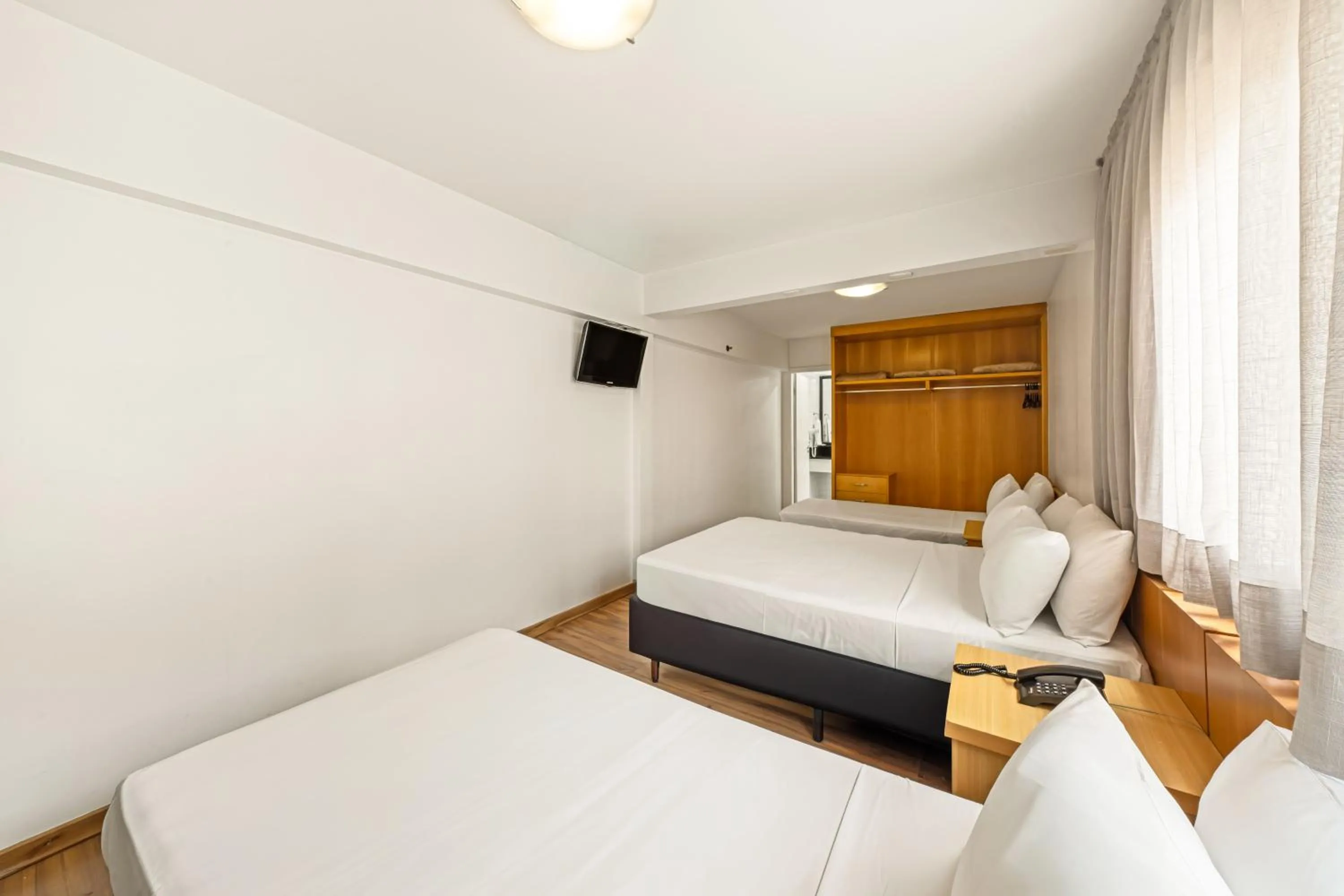 Bed in Slim Hotel São Paulo Congonhas