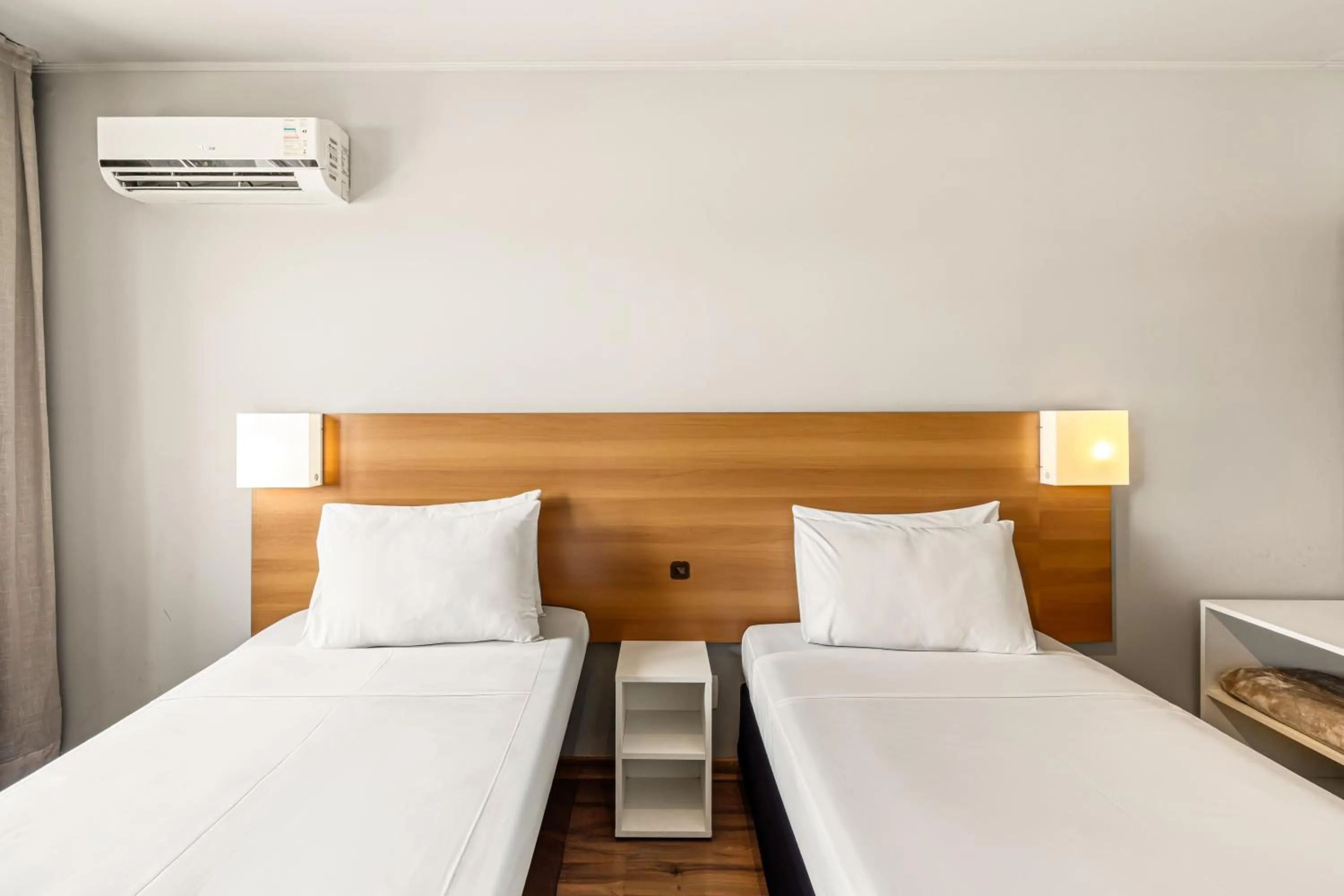 Bed in Slim Hotel São Paulo Congonhas