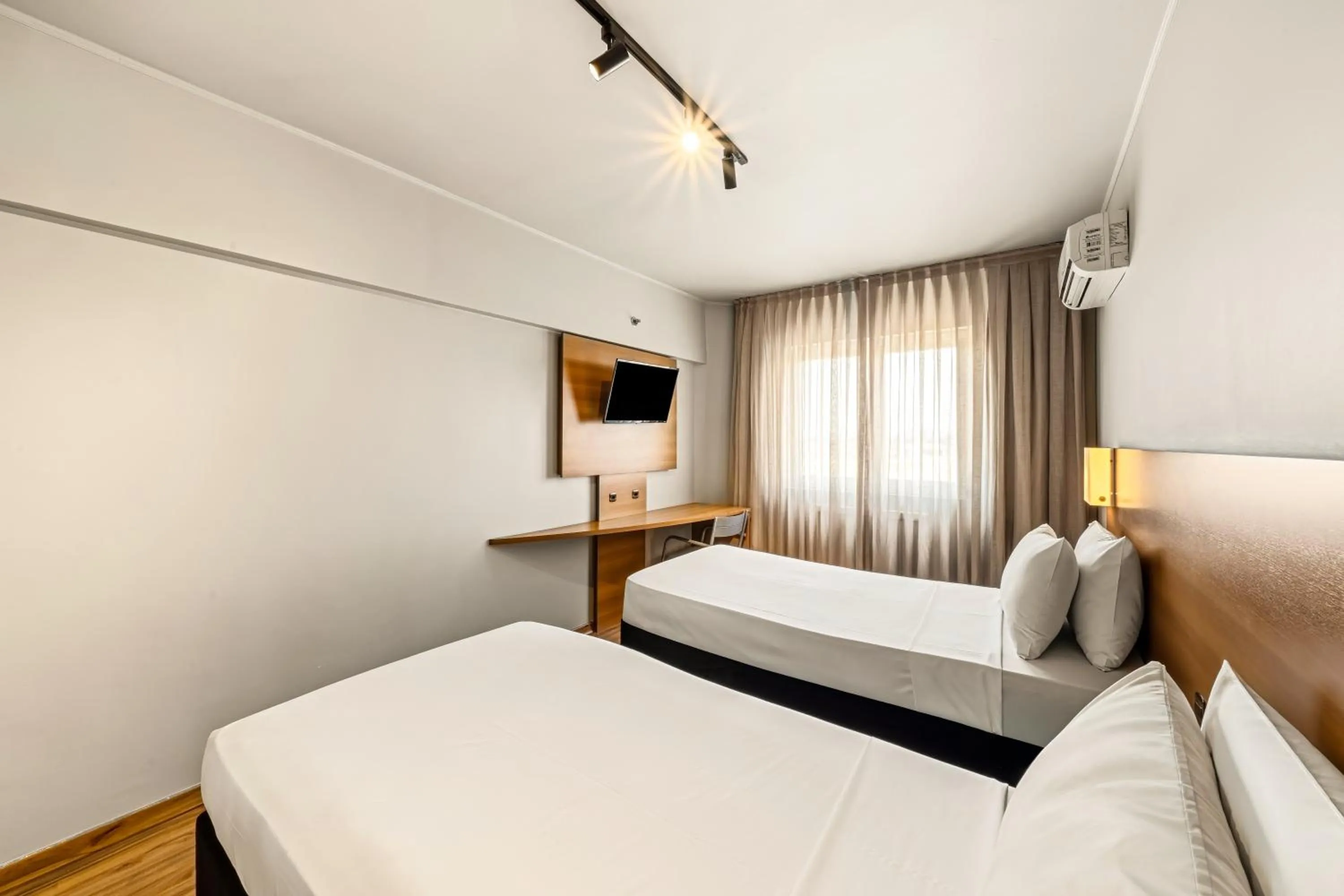 Bed in Slim Hotel São Paulo Congonhas