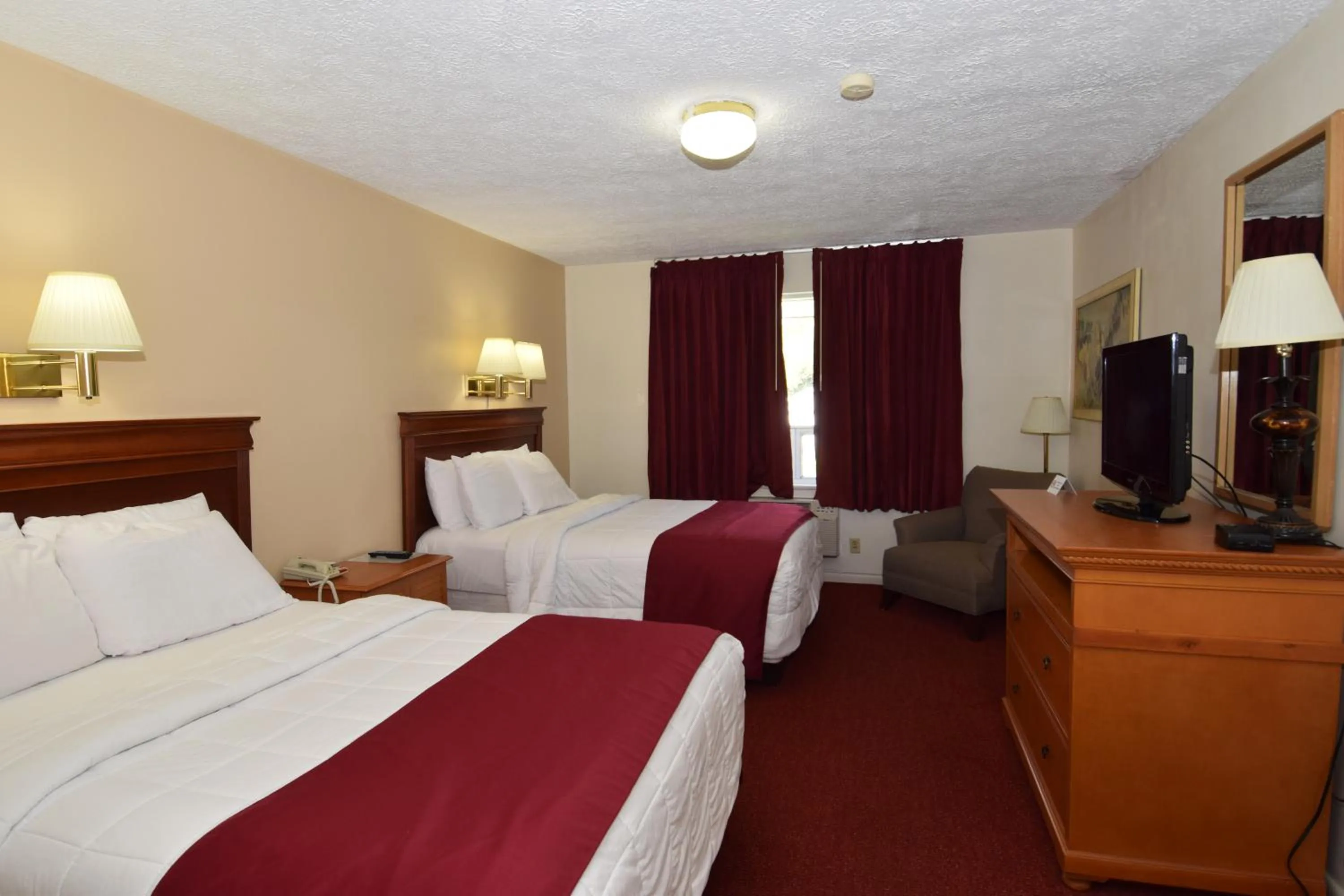 Bed in Knights Inn Oswego East