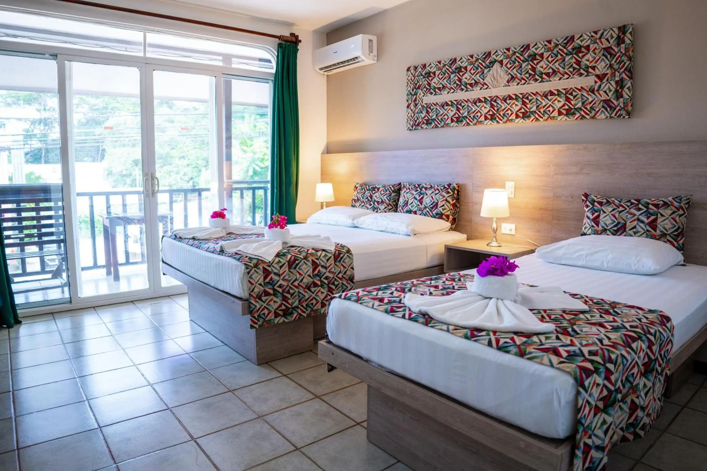 Quadruple Room with Main Street View in Hotel Giada Quadruple Room with Main Street View in Hotel Giada