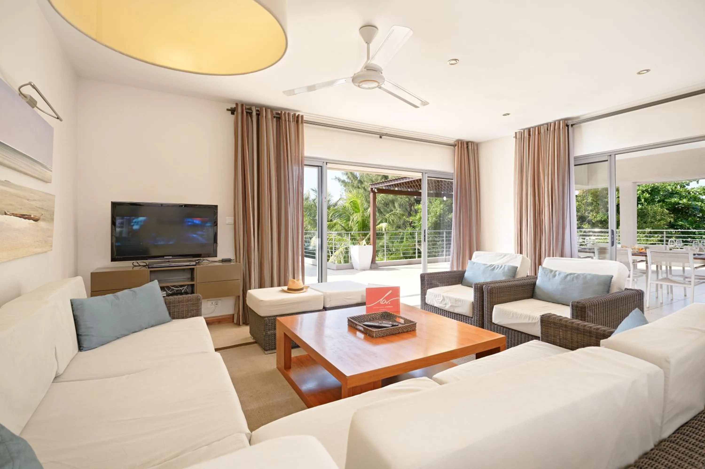 TV and multimedia in Bon Azur Beachfront Suites & Penthouses by LOV Mauritius