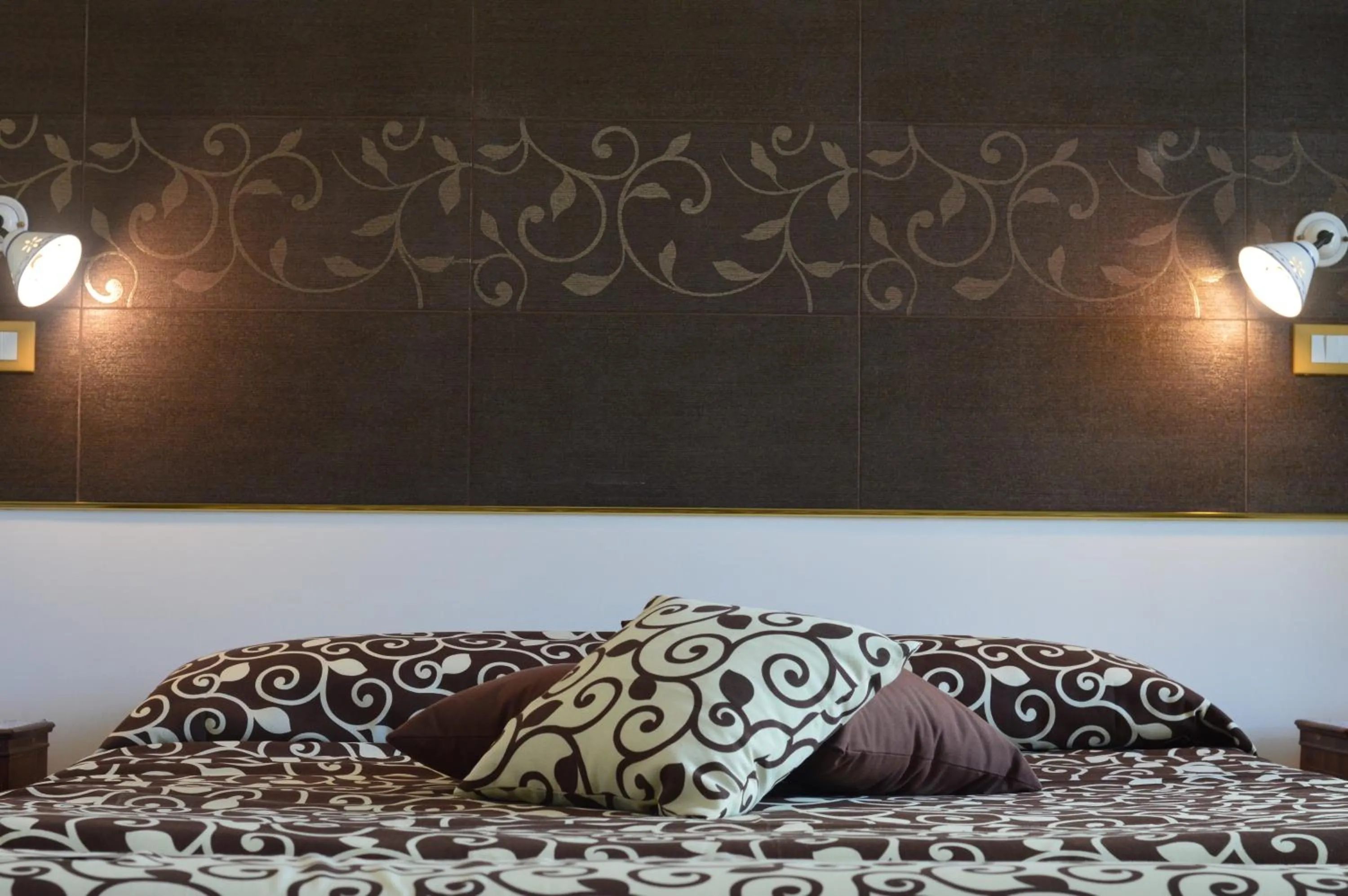 Decorative detail, Bed in Centro Sicilia Rooms & Suites