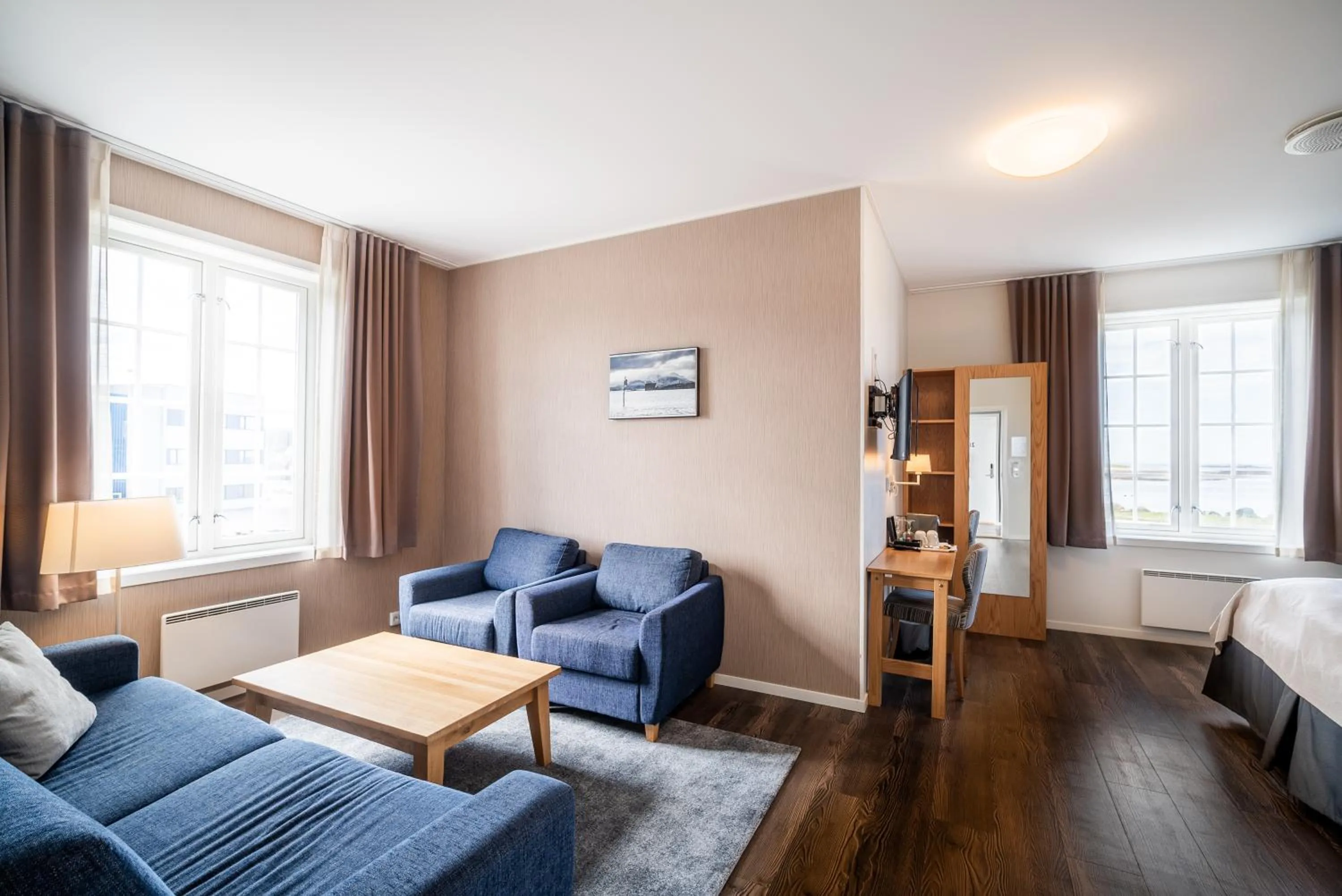 Seating area, Bed in Finnøy Bryggehotell - by Classic Norway Hotels