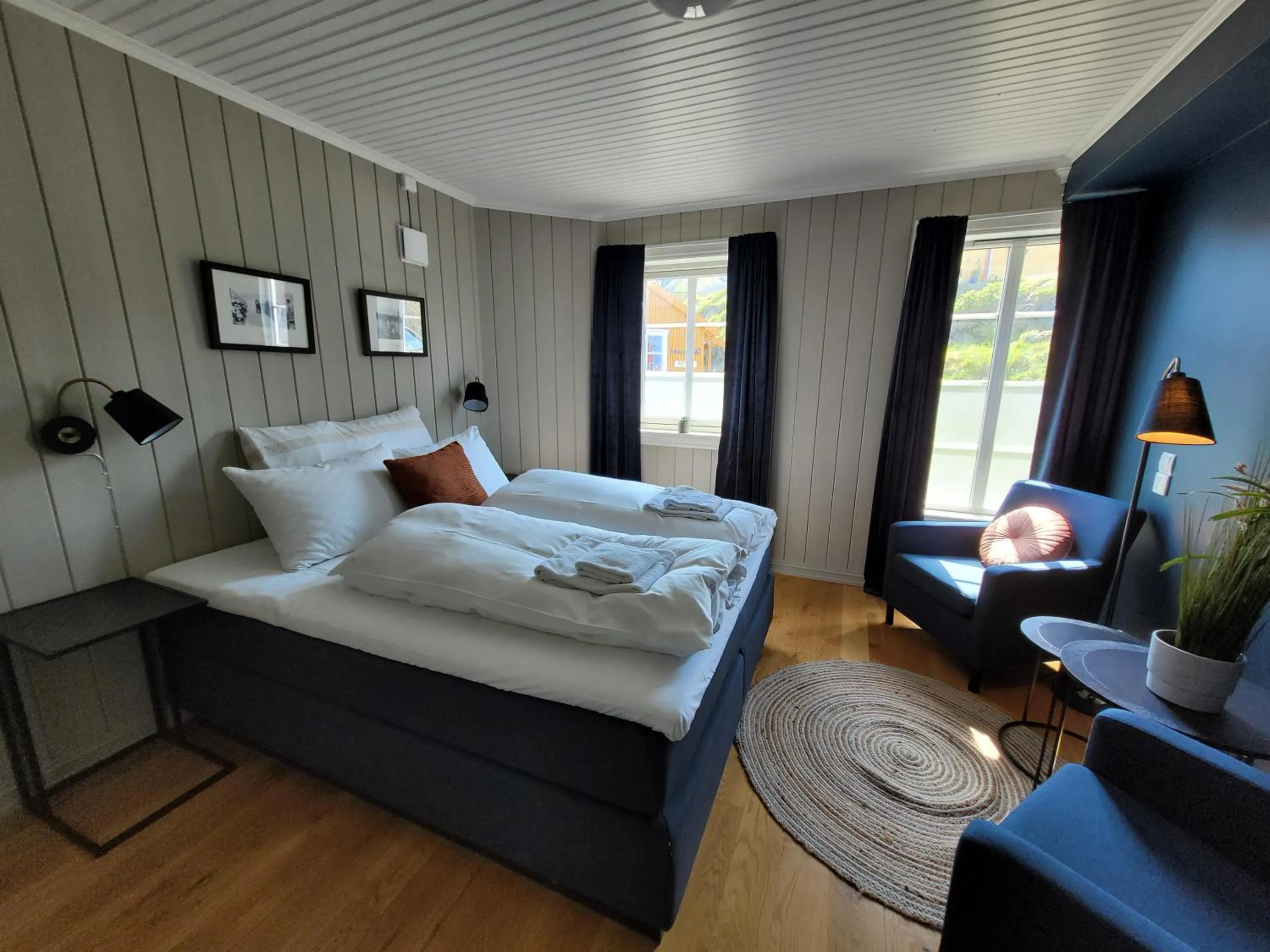 Photo of the whole room, Bed in Ona Havstuer - by Classic Norway Hotels