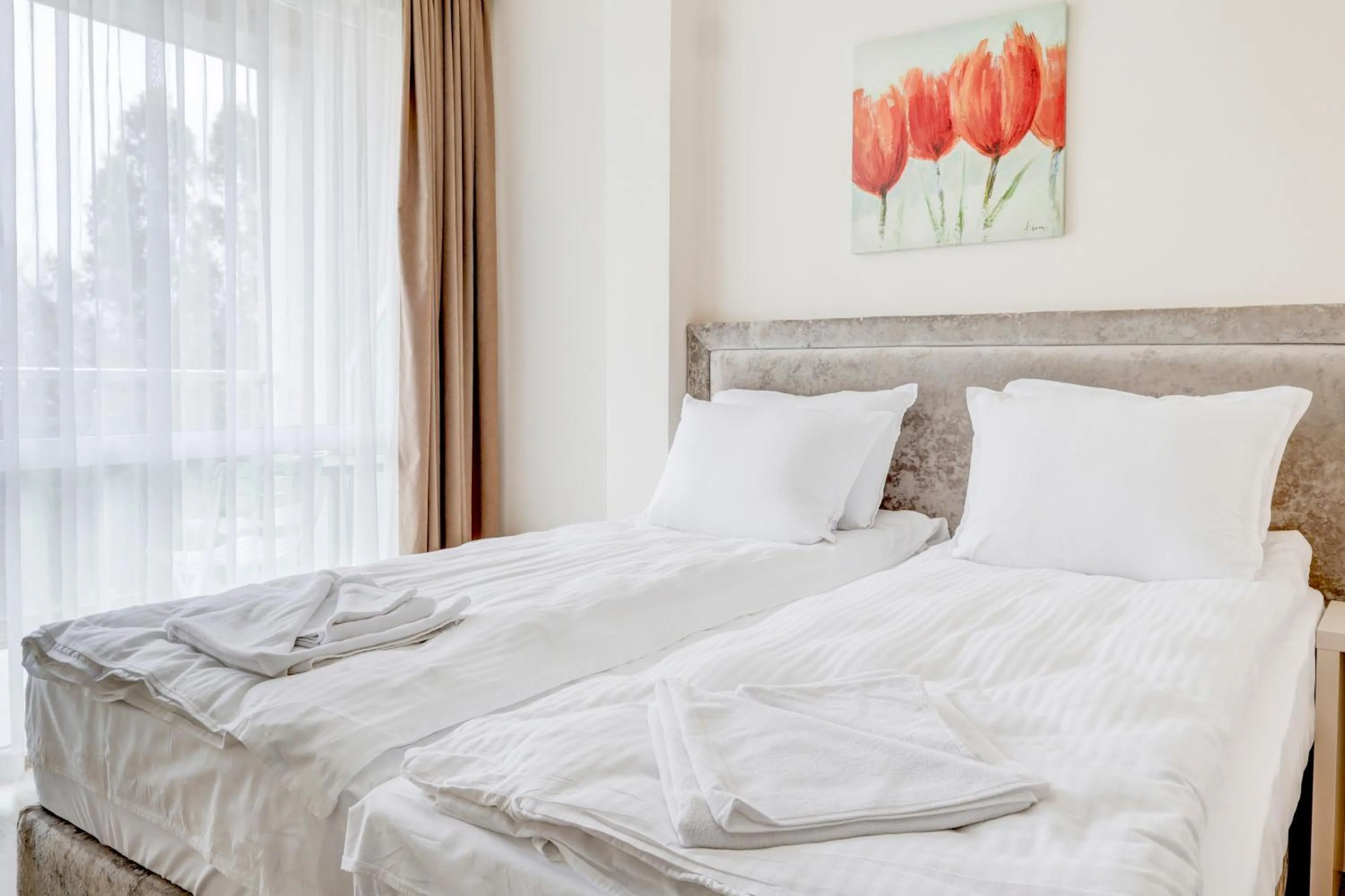 Bed in Jupiter 1 Family Hotel