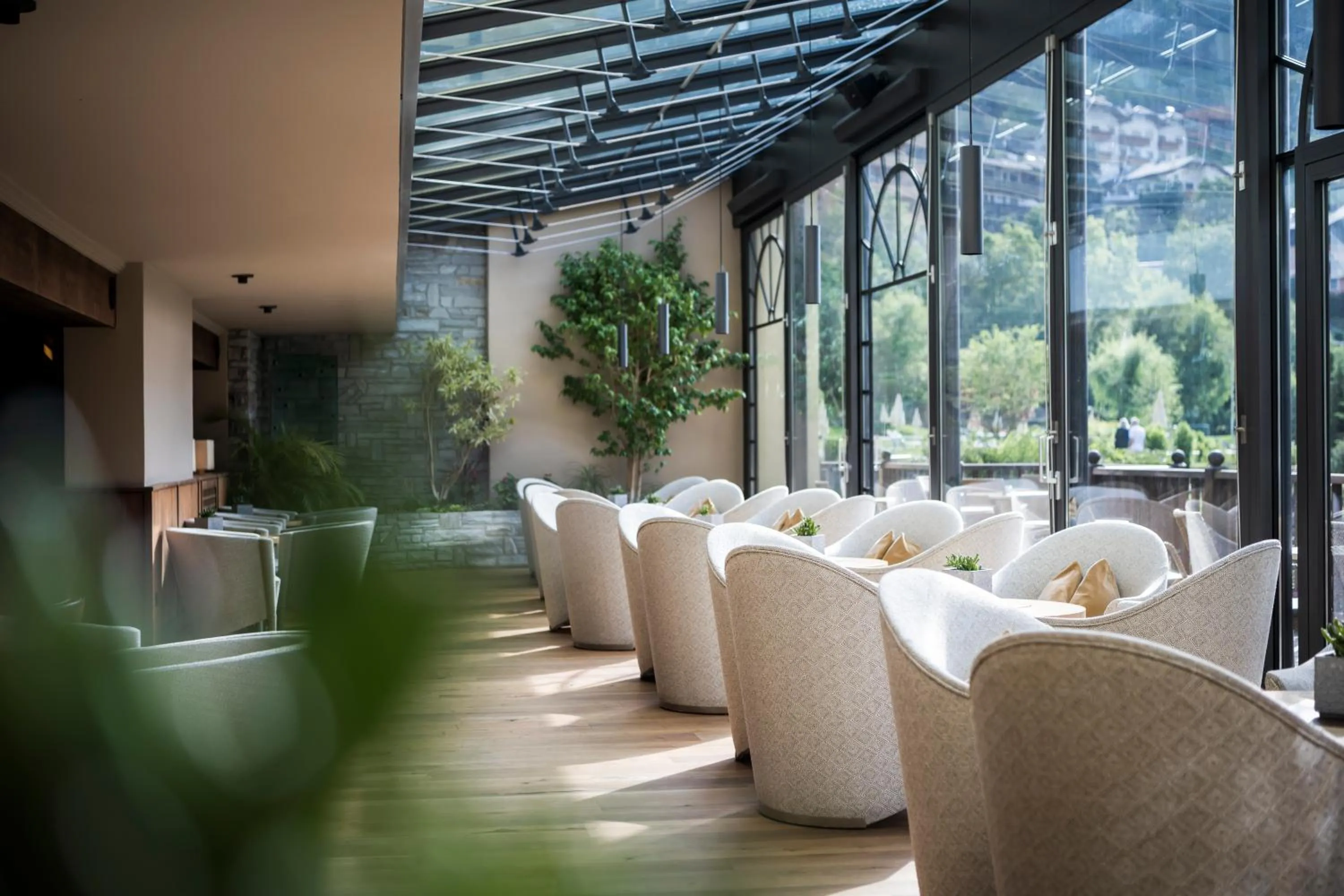 Communal lounge/ TV room in Adler Spa Resort Dolomiti