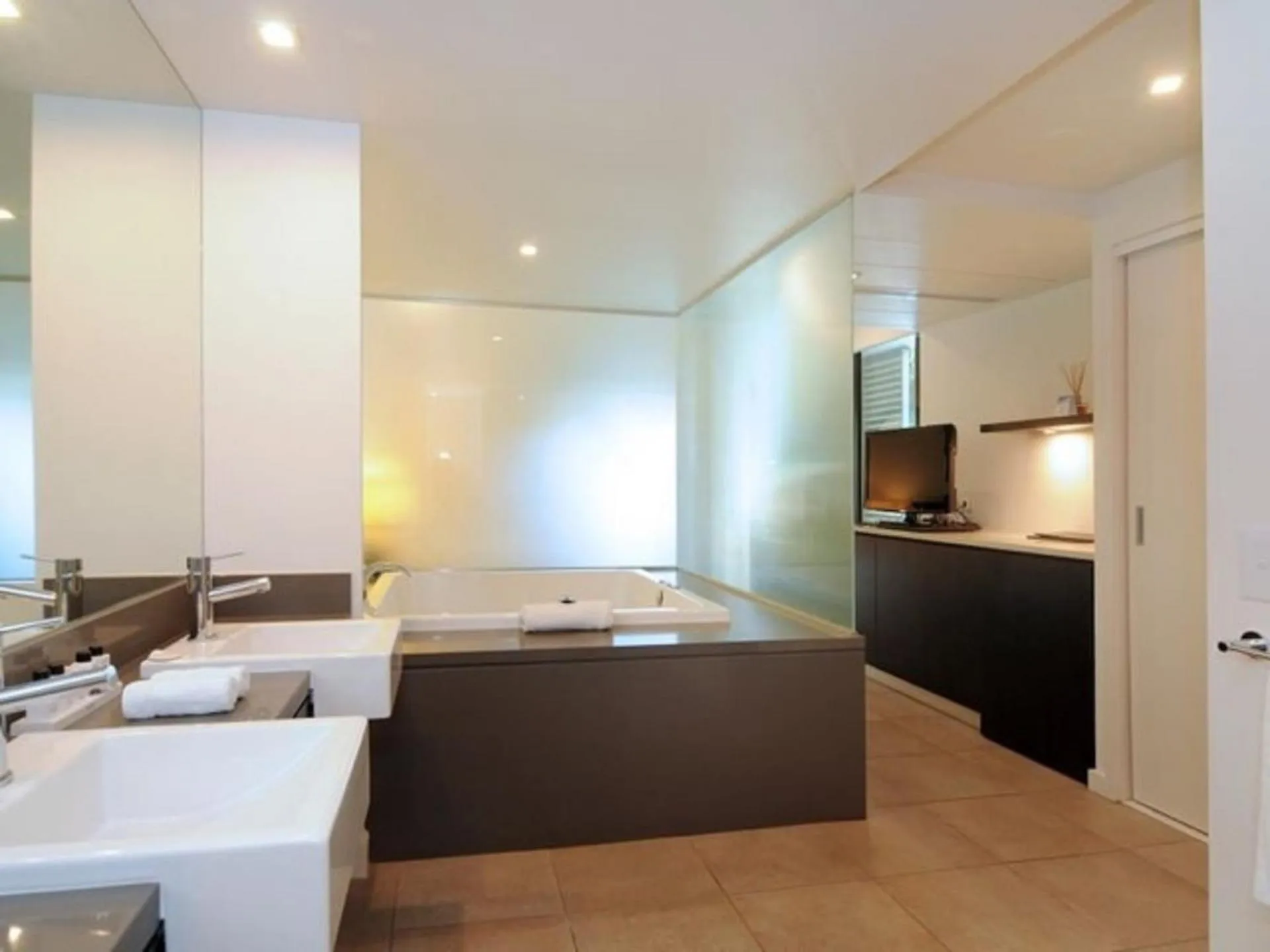 Bathroom, Bed in Luxury Apartments at Temple Resort and Spa Port Douglas