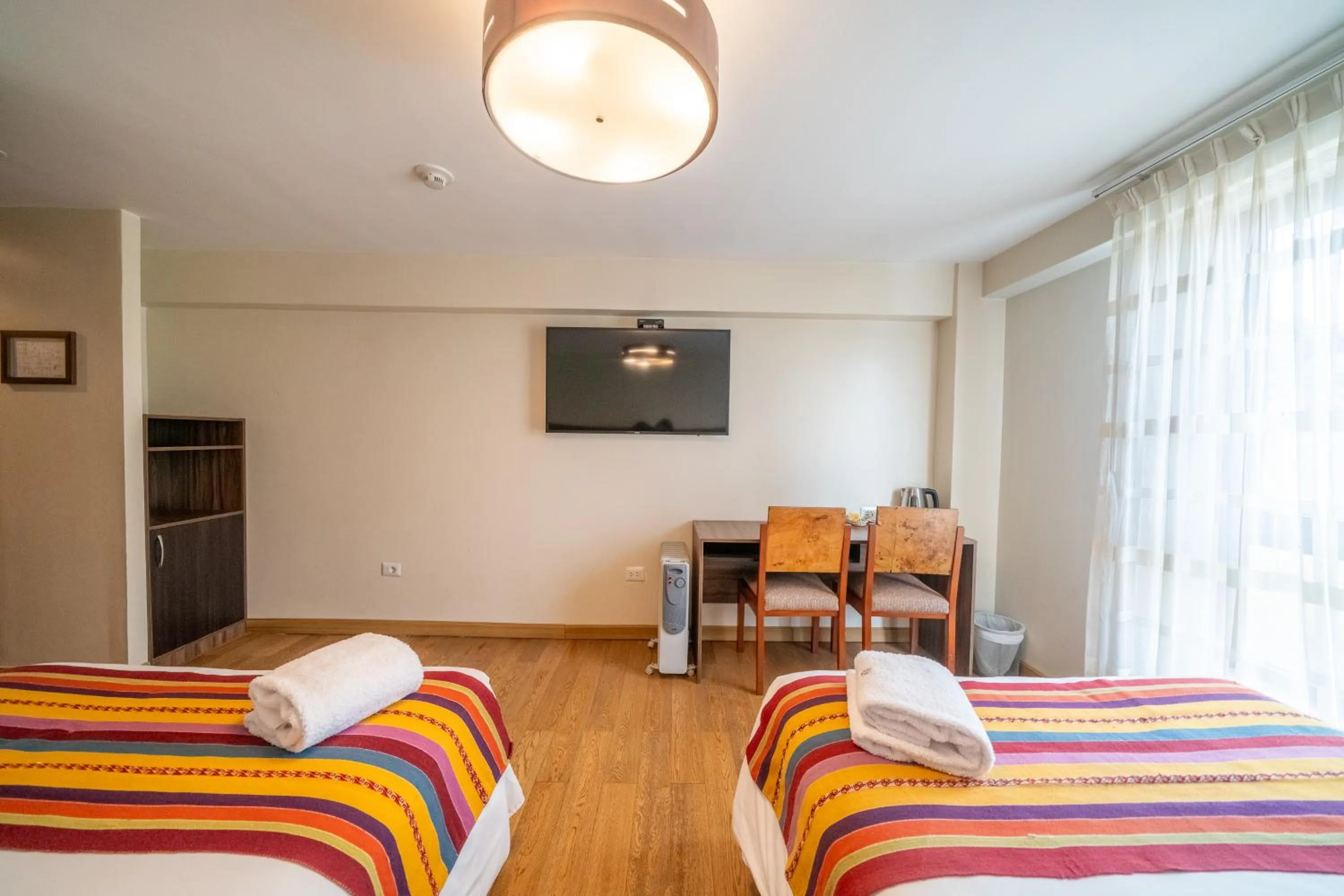 Photo of the whole room, Bed in Taypikala Hotel Cusco