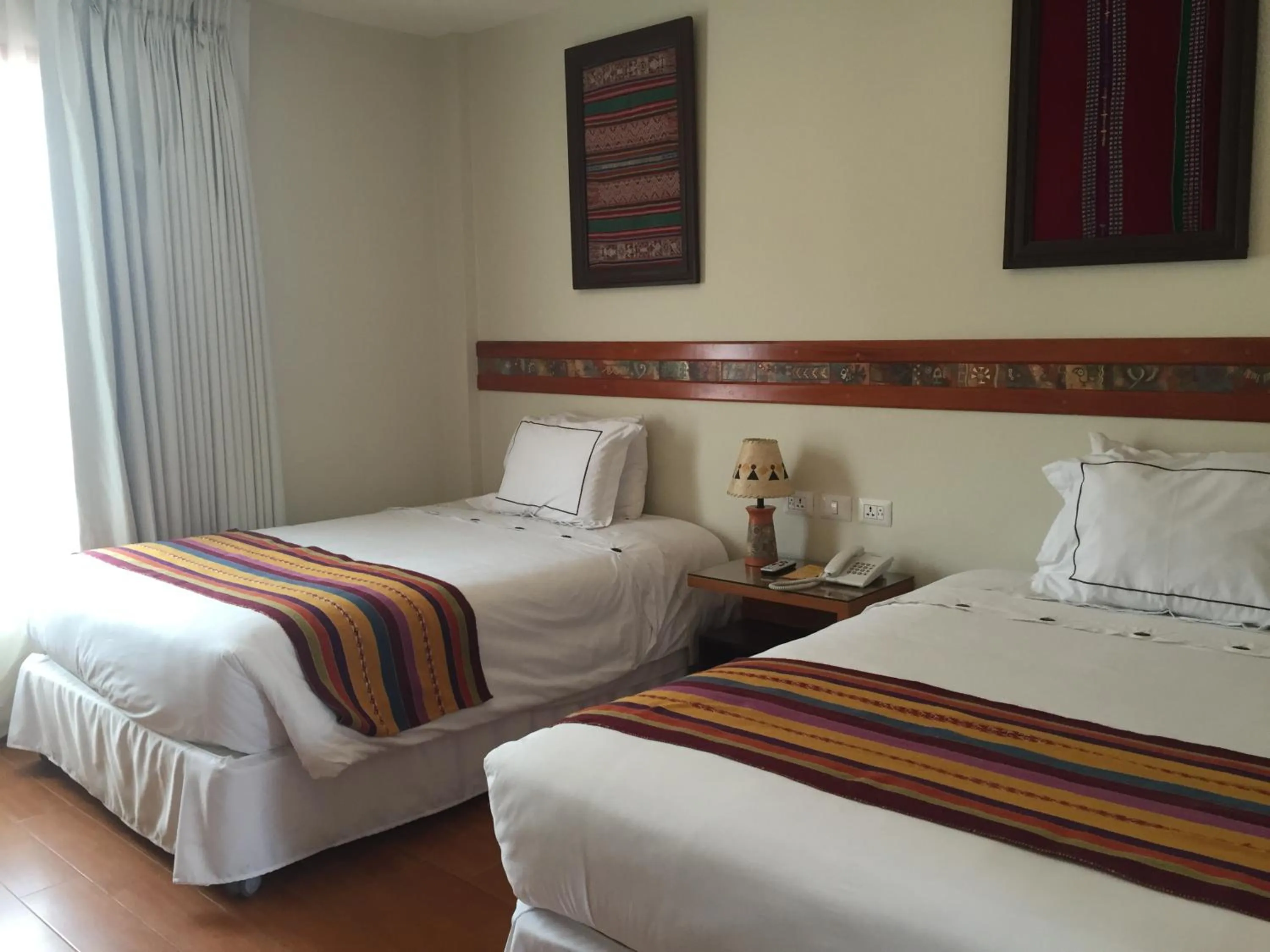 Bed in Taypikala Hotel Cusco