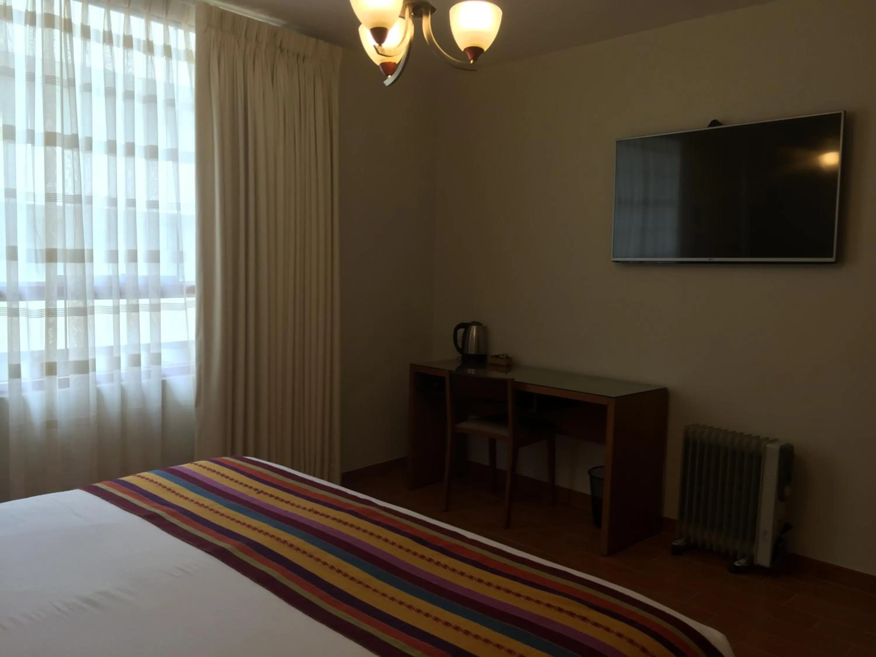 Bed in Taypikala Hotel Cusco