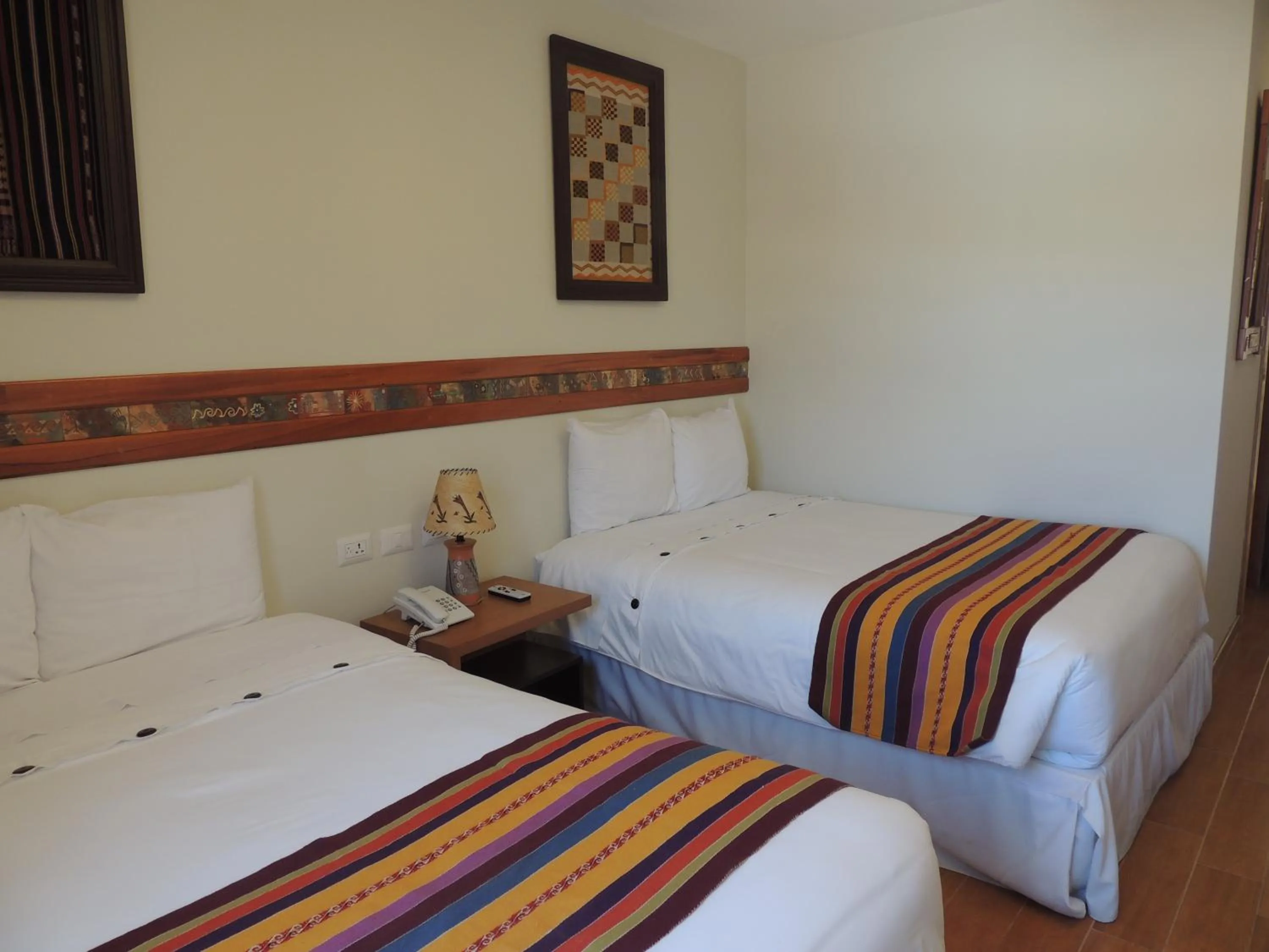 Bed in Taypikala Hotel Cusco