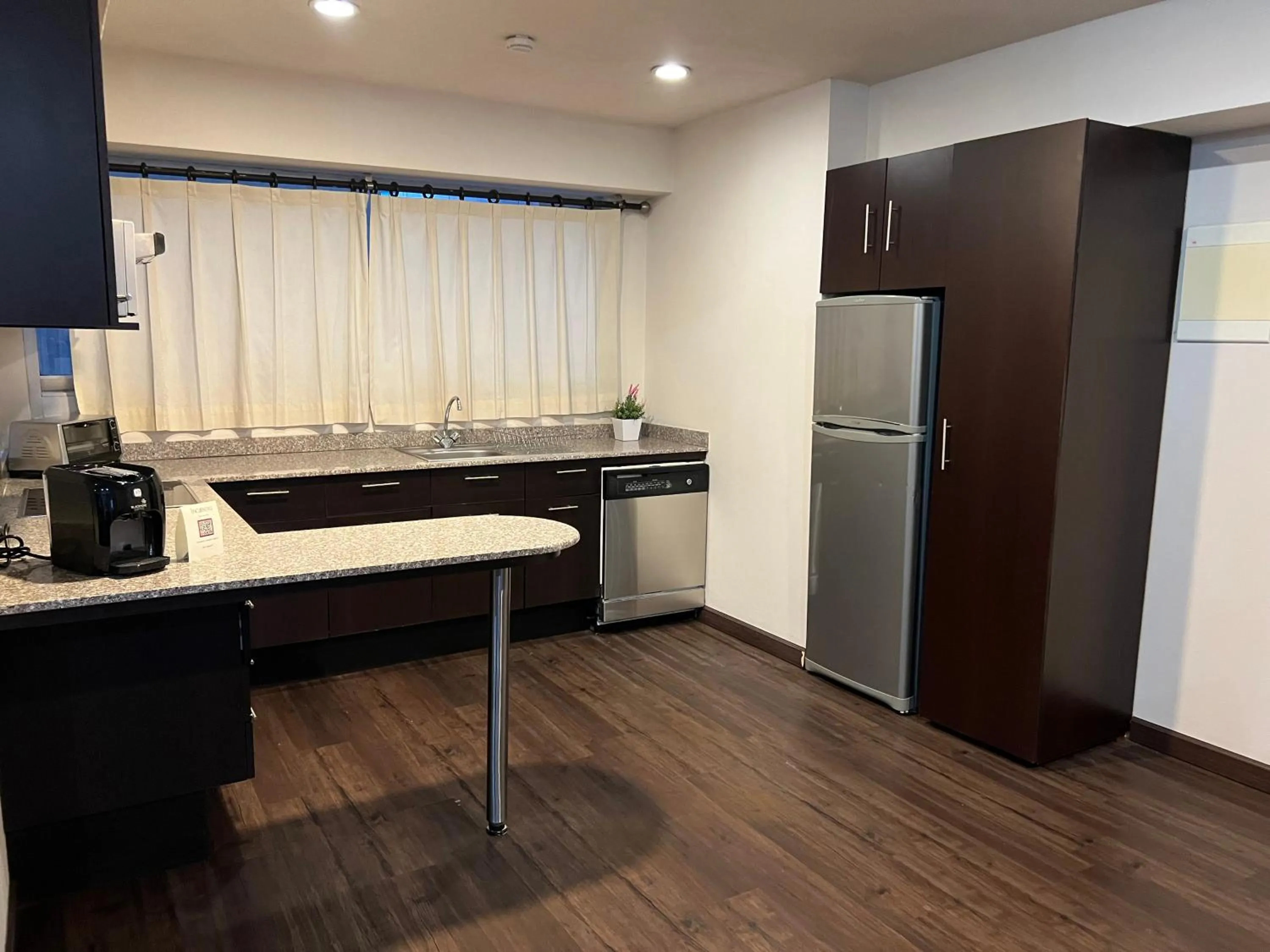 Kitchen or kitchenette in St Isidro Suites Corporate Housing SPA & Wellness Center