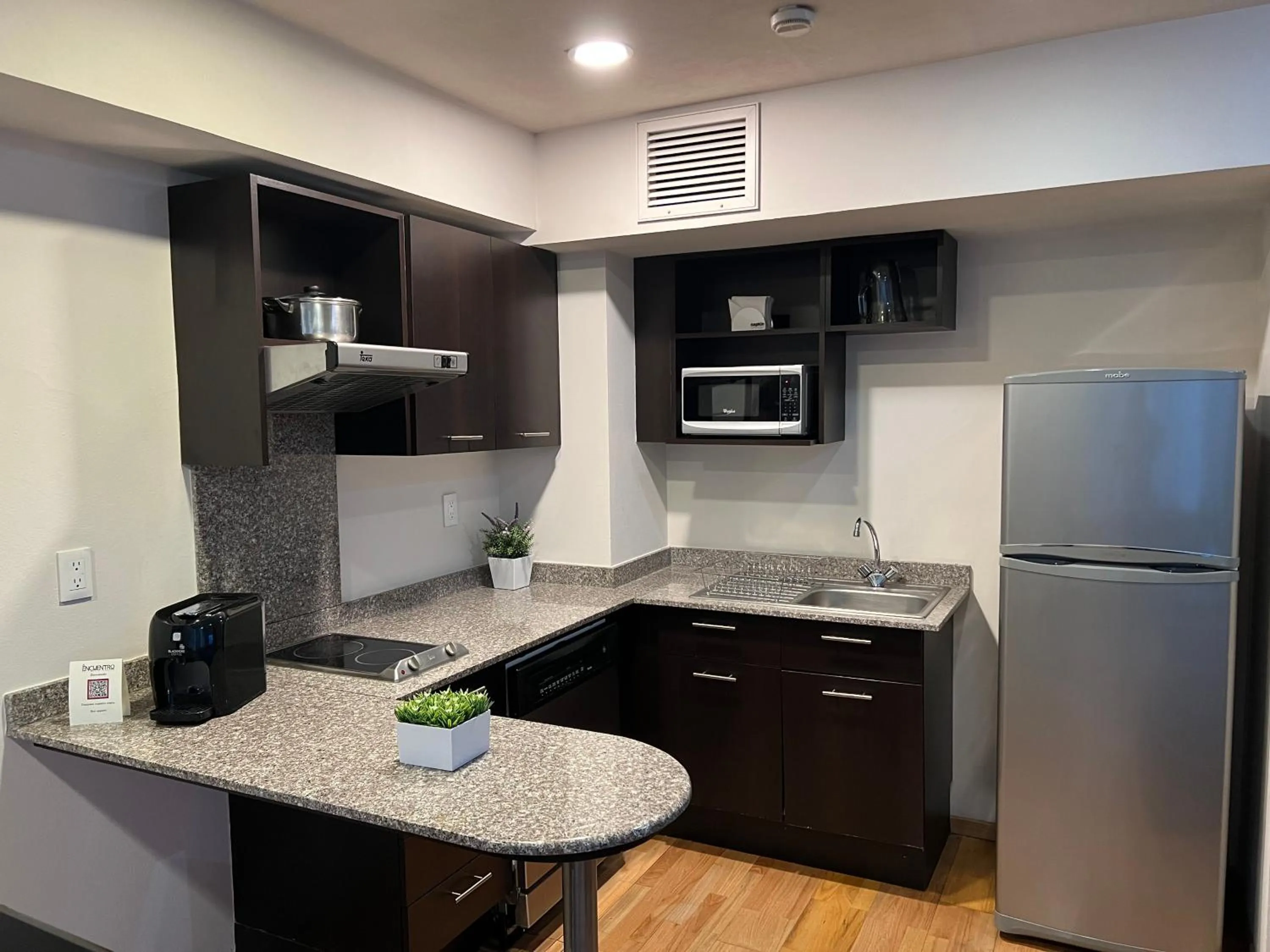 Kitchen or kitchenette in St Isidro Suites Corporate Housing SPA & Wellness Center