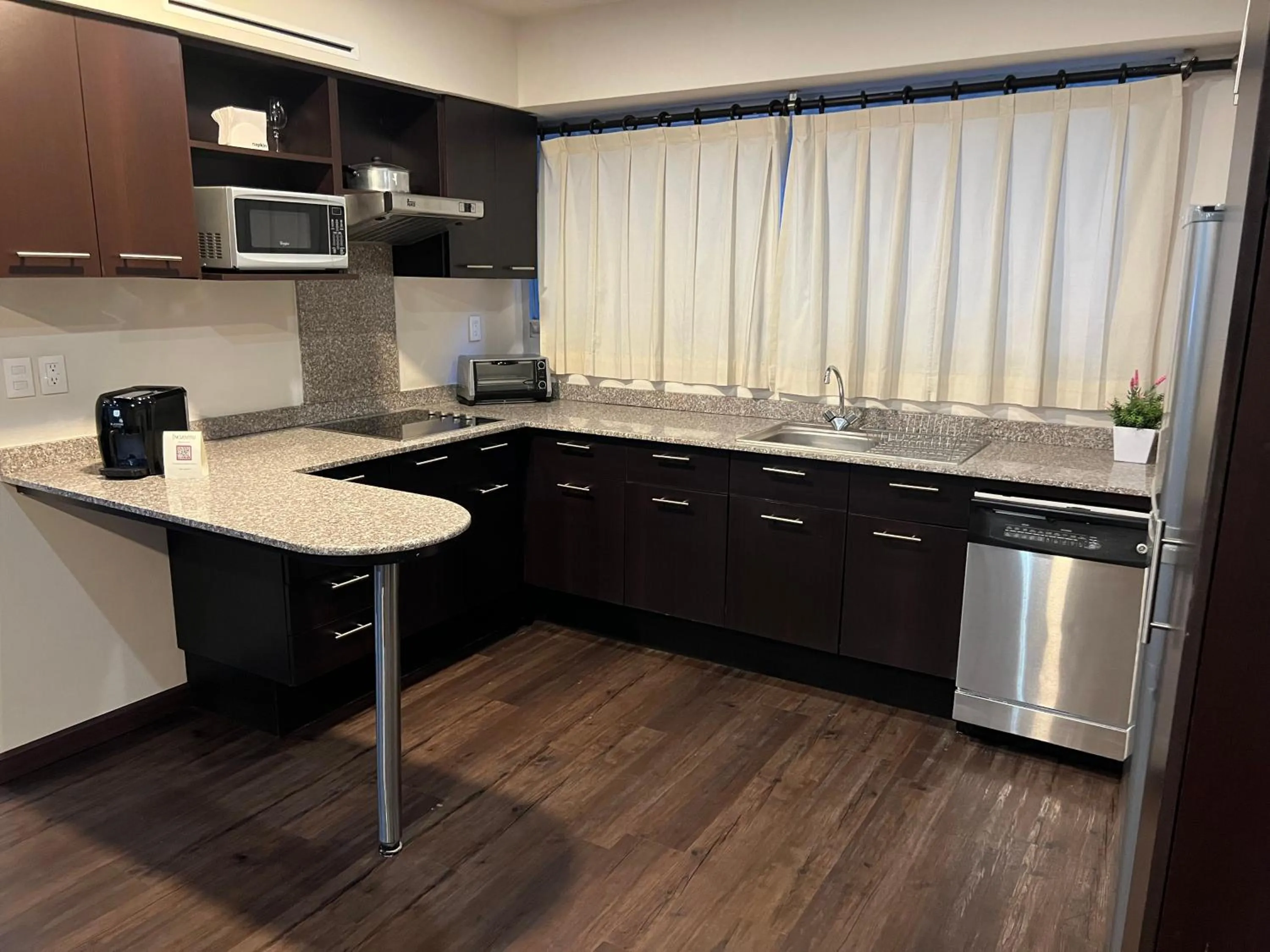 Kitchen or kitchenette in St Isidro Suites Corporate Housing SPA & Wellness Center