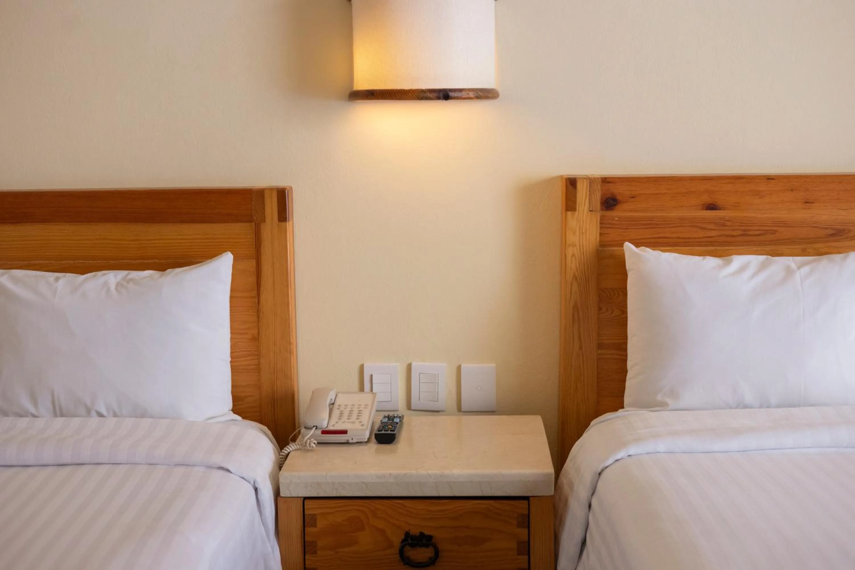 Bed in Hotel Rancho San Diego Grand Spa Resort