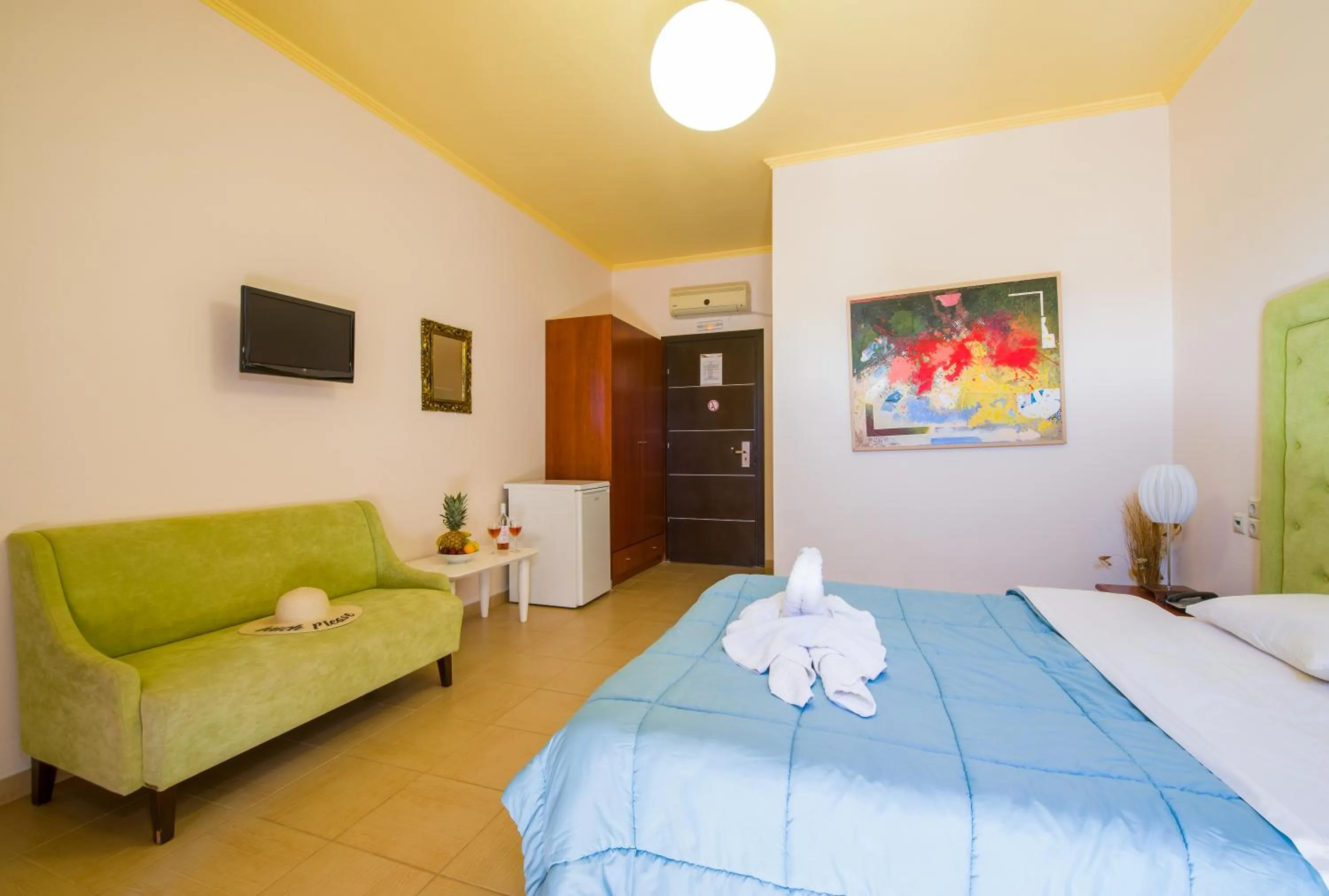 Seating area, Bed in Paradice Hotel Luxury Suites-Near zorbas Beach-FREE Breakfast