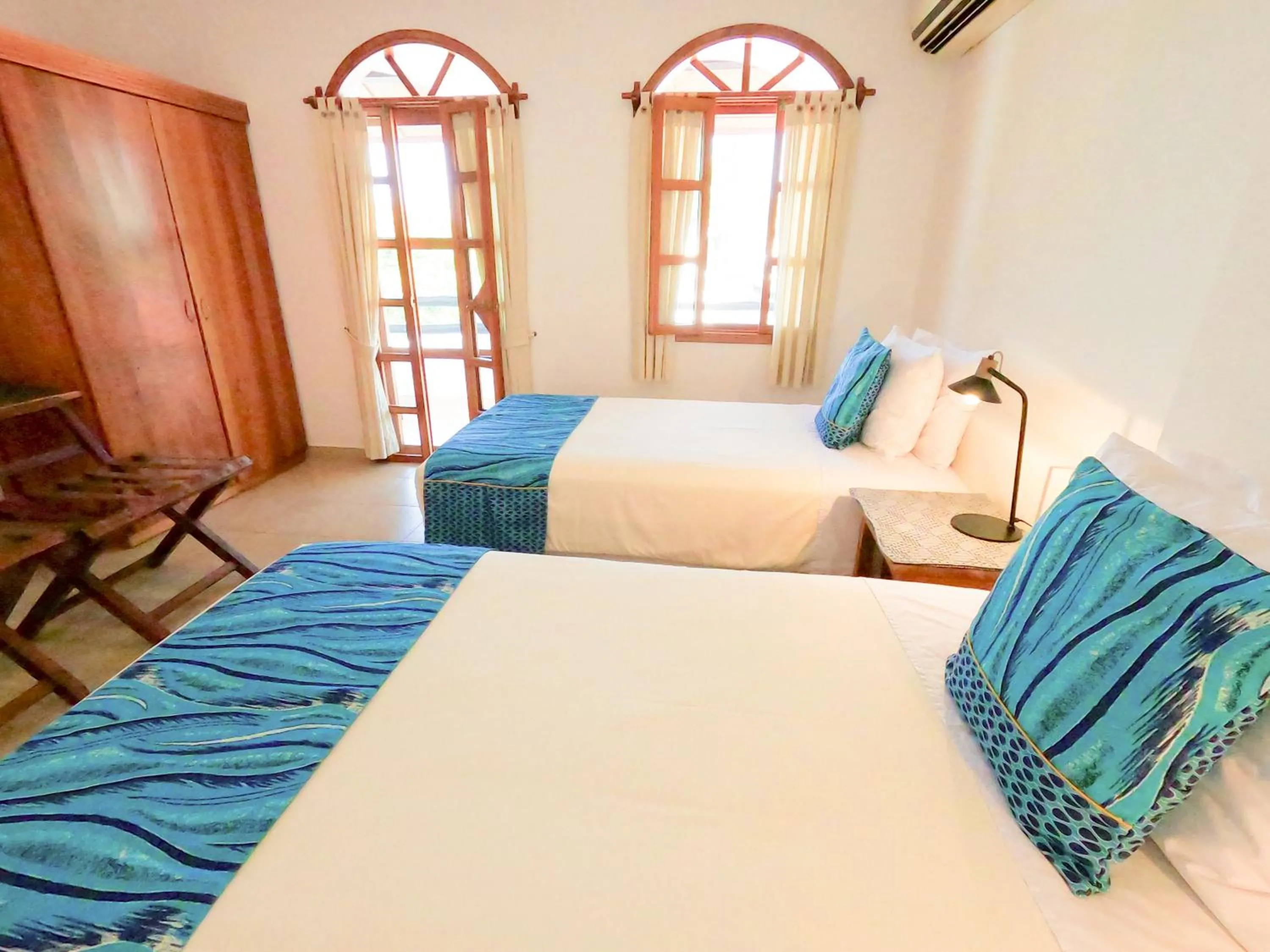 Bed in Hotel Galapagos Suites B&B