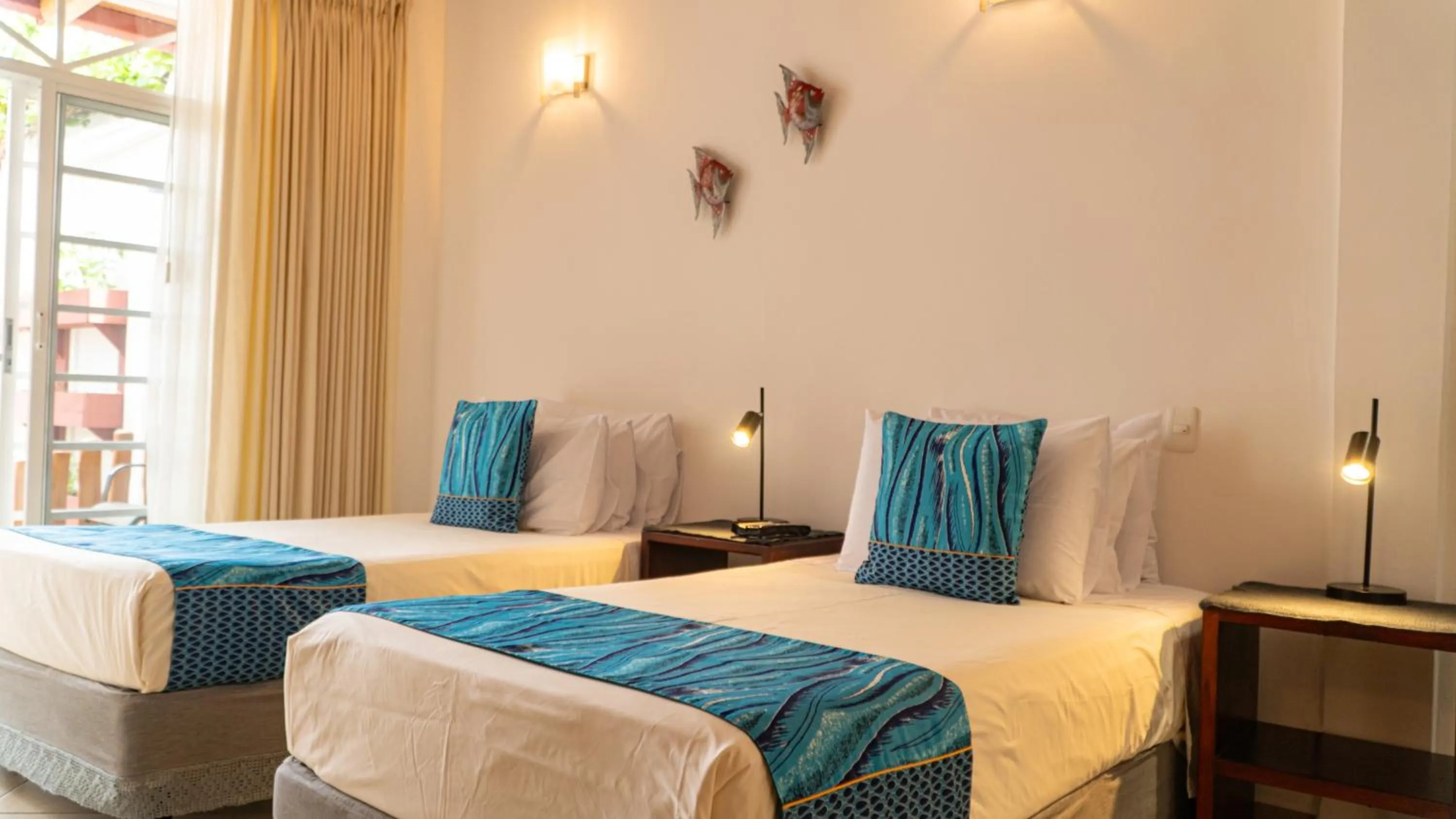 Bed in Hotel Galapagos Suites B&B