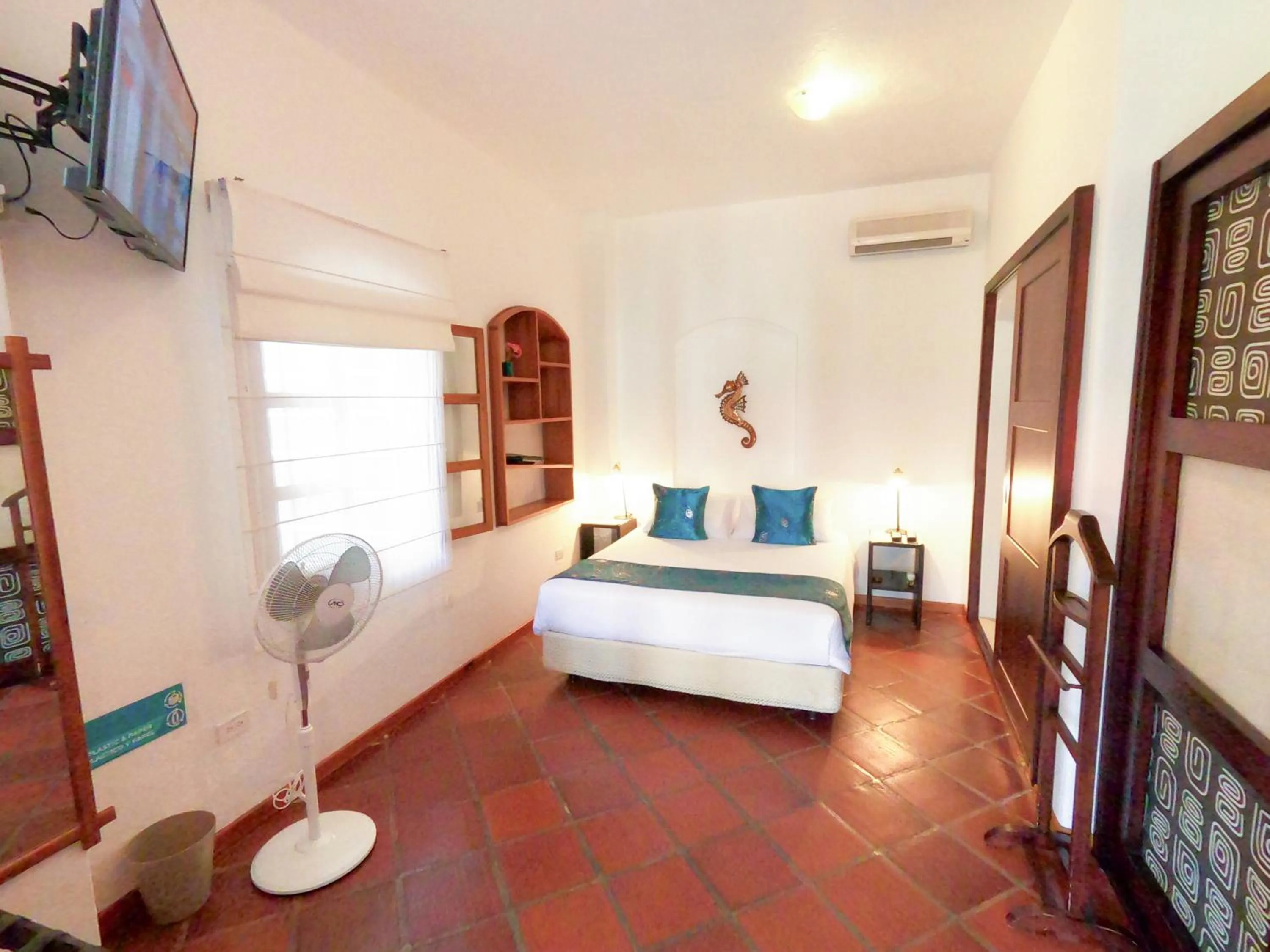 Bed in Hotel Galapagos Suites B&B