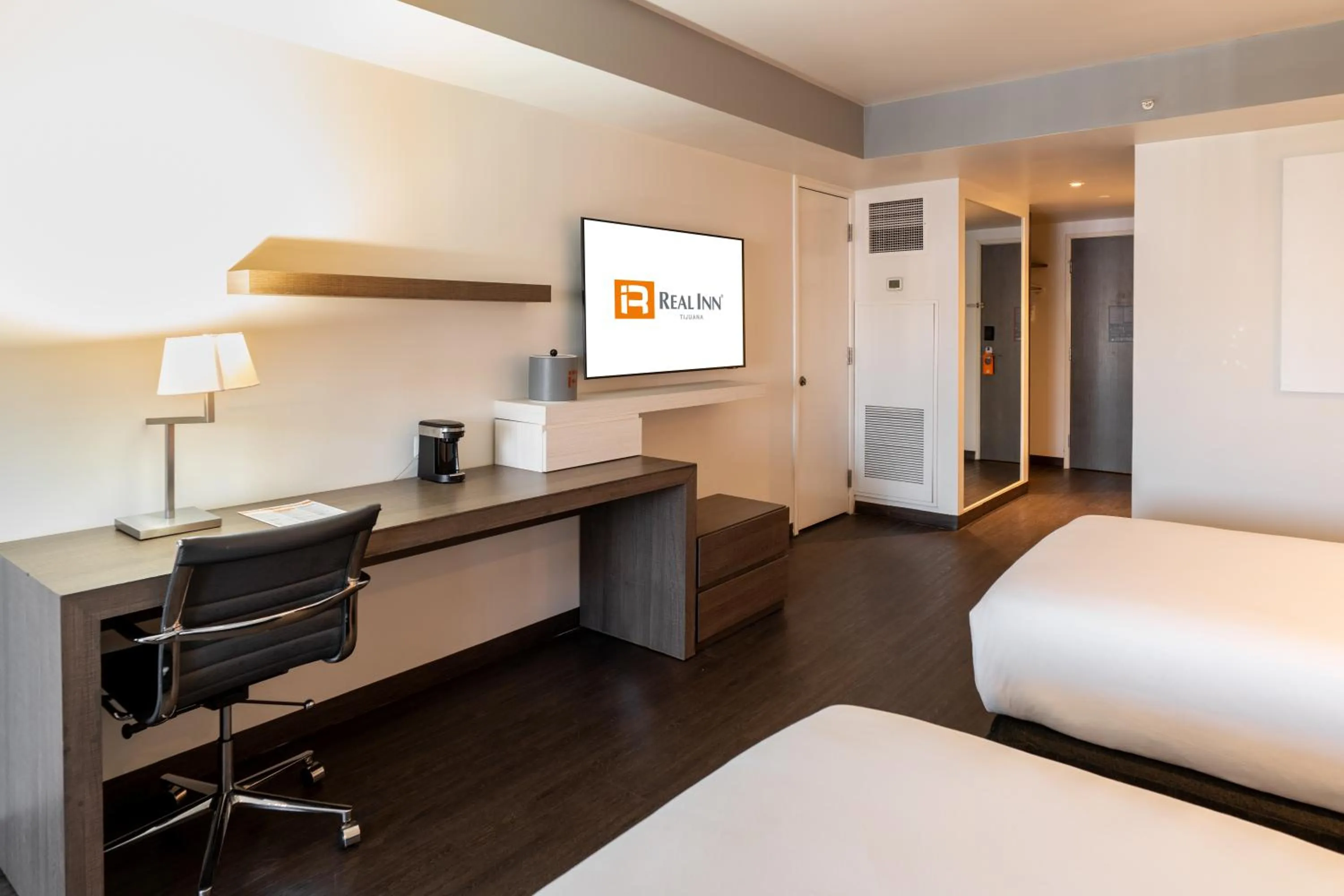 Bed in Real Inn Tijuana by Camino Real Hoteles