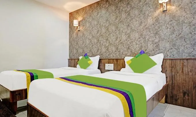 Bed in Hotel Varsha Palace