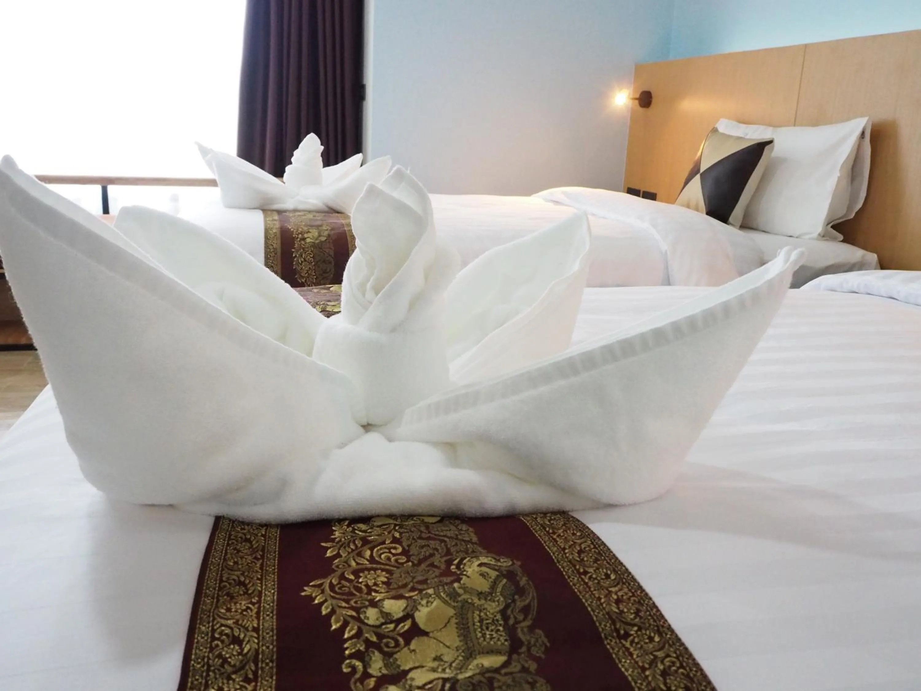 Bed in Samui City Hotel