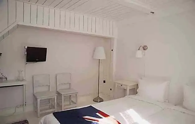 Seating area, Bed in Johanssons Gårdshotell i Roslagen