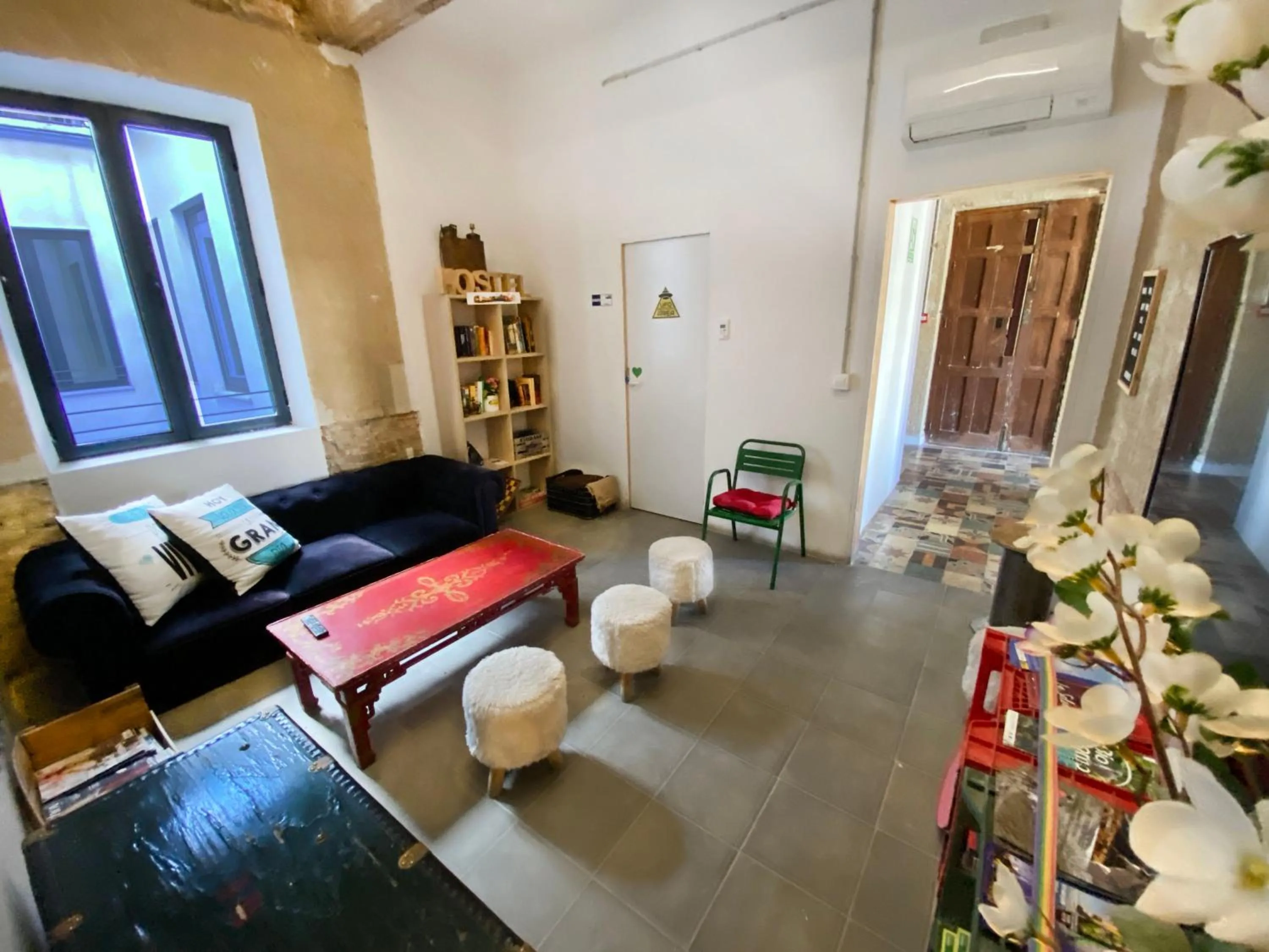 Communal lounge/ TV room in ECO Hostel