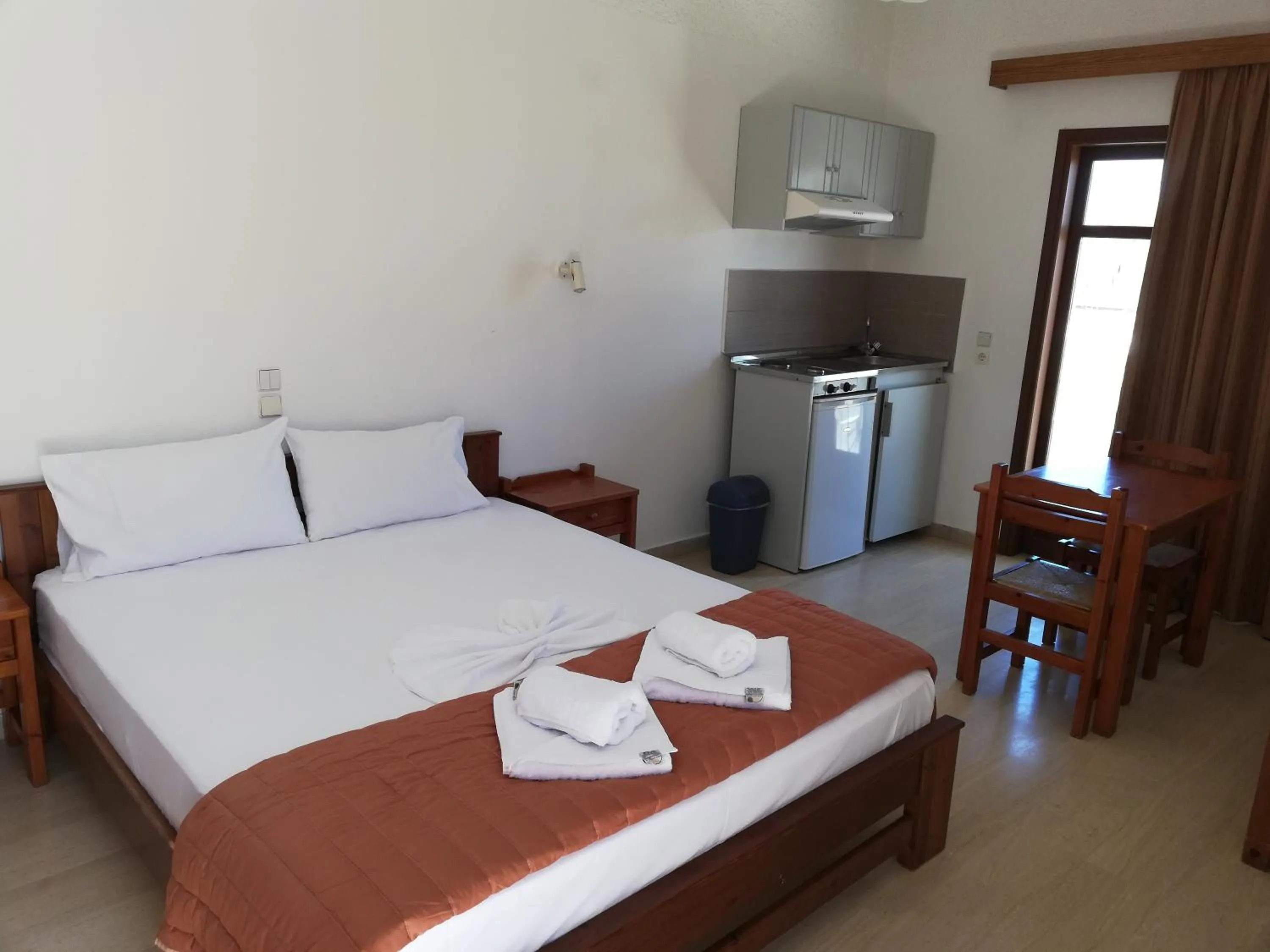 Bed in Karmi Apartments