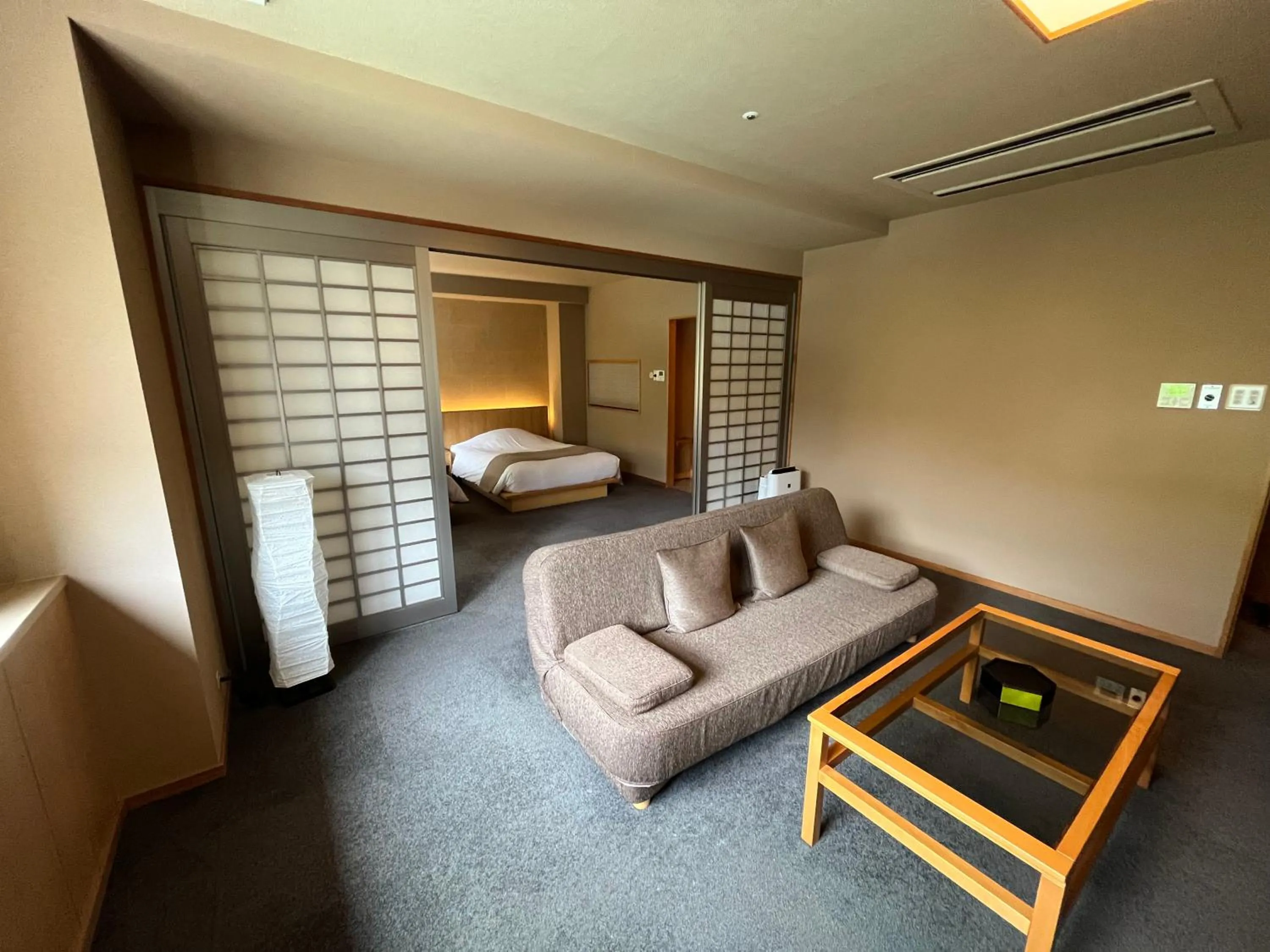 Living room, Bed in Jozankei Daiichi Hotel Suizantei