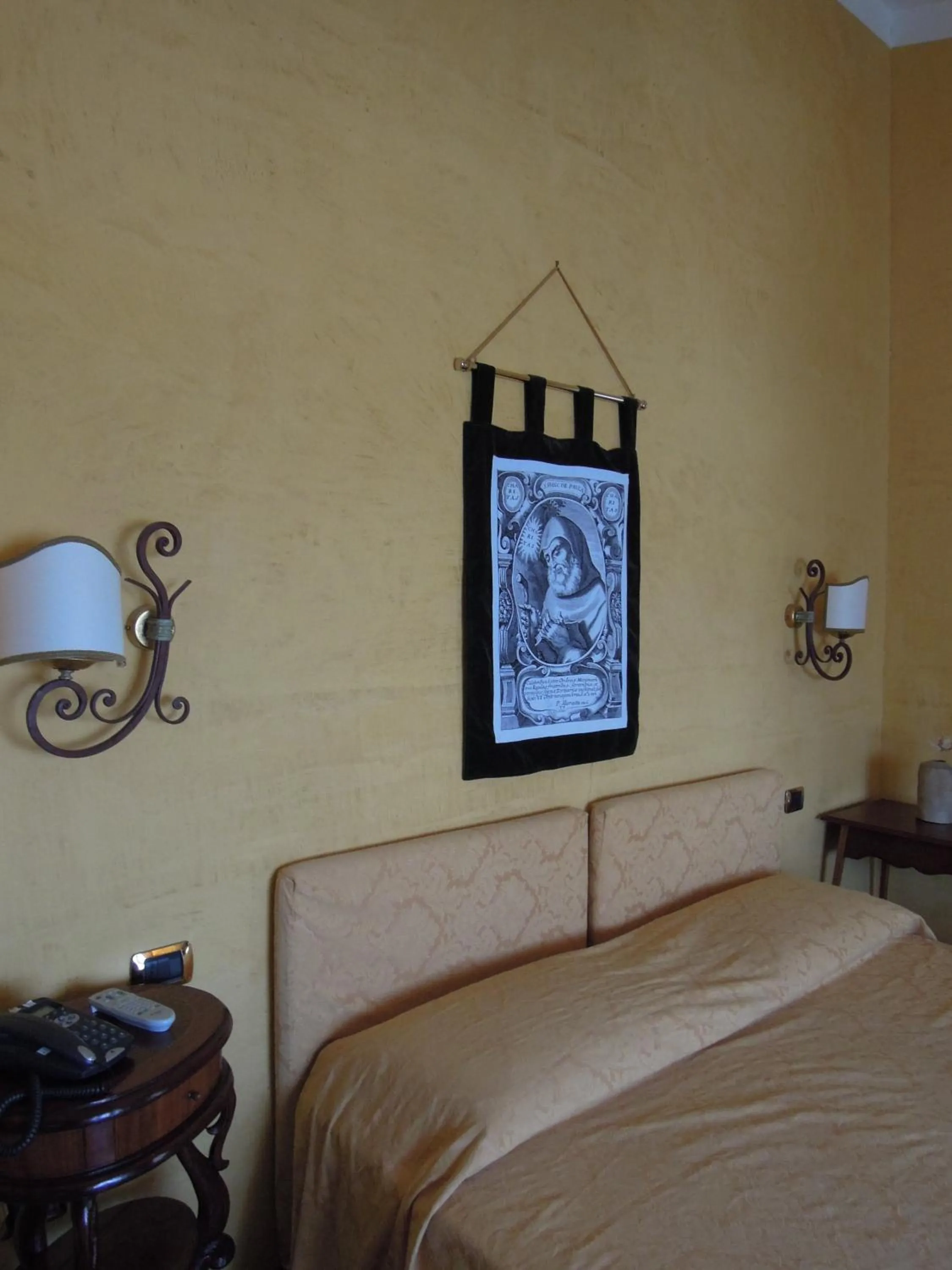 Decorative detail, Bed in Sant'Agostino Guest Rooms