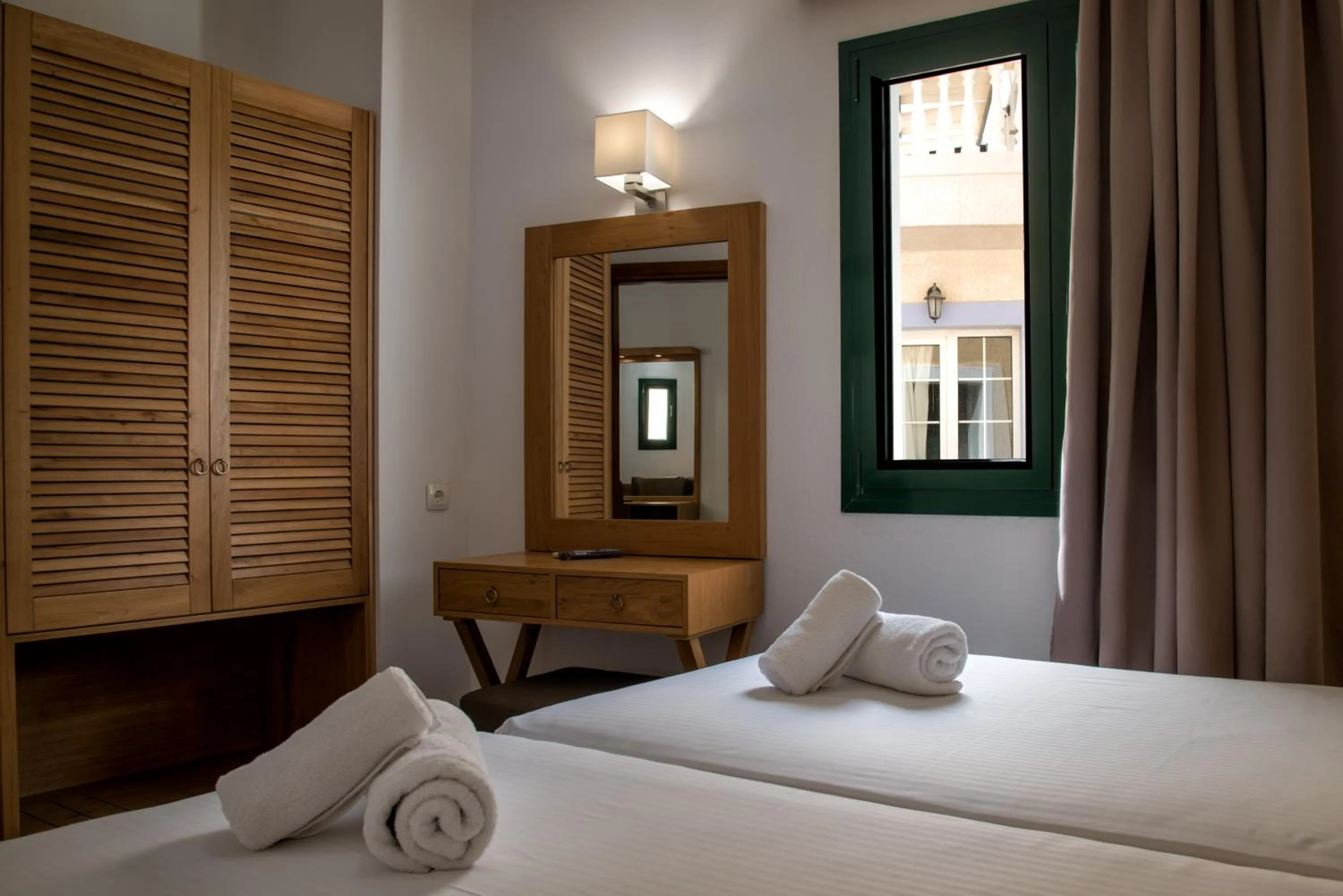 Bed in Elmi Beach Hotel & Suites