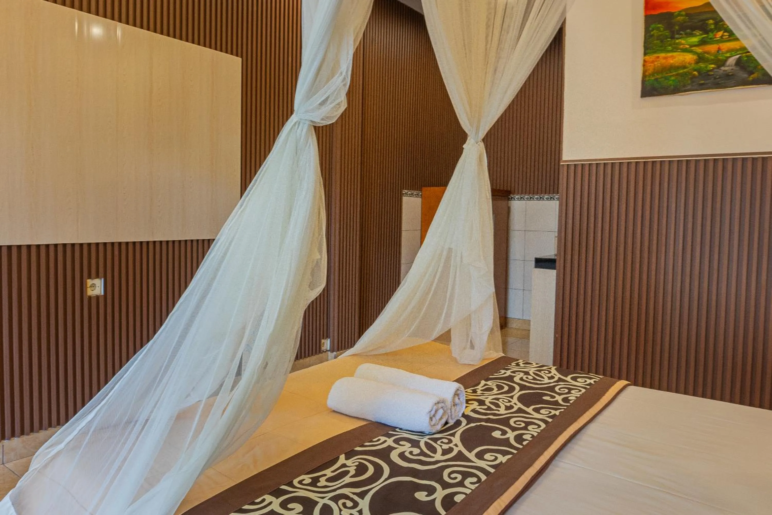 Bed in Artha Dewata Home Stay