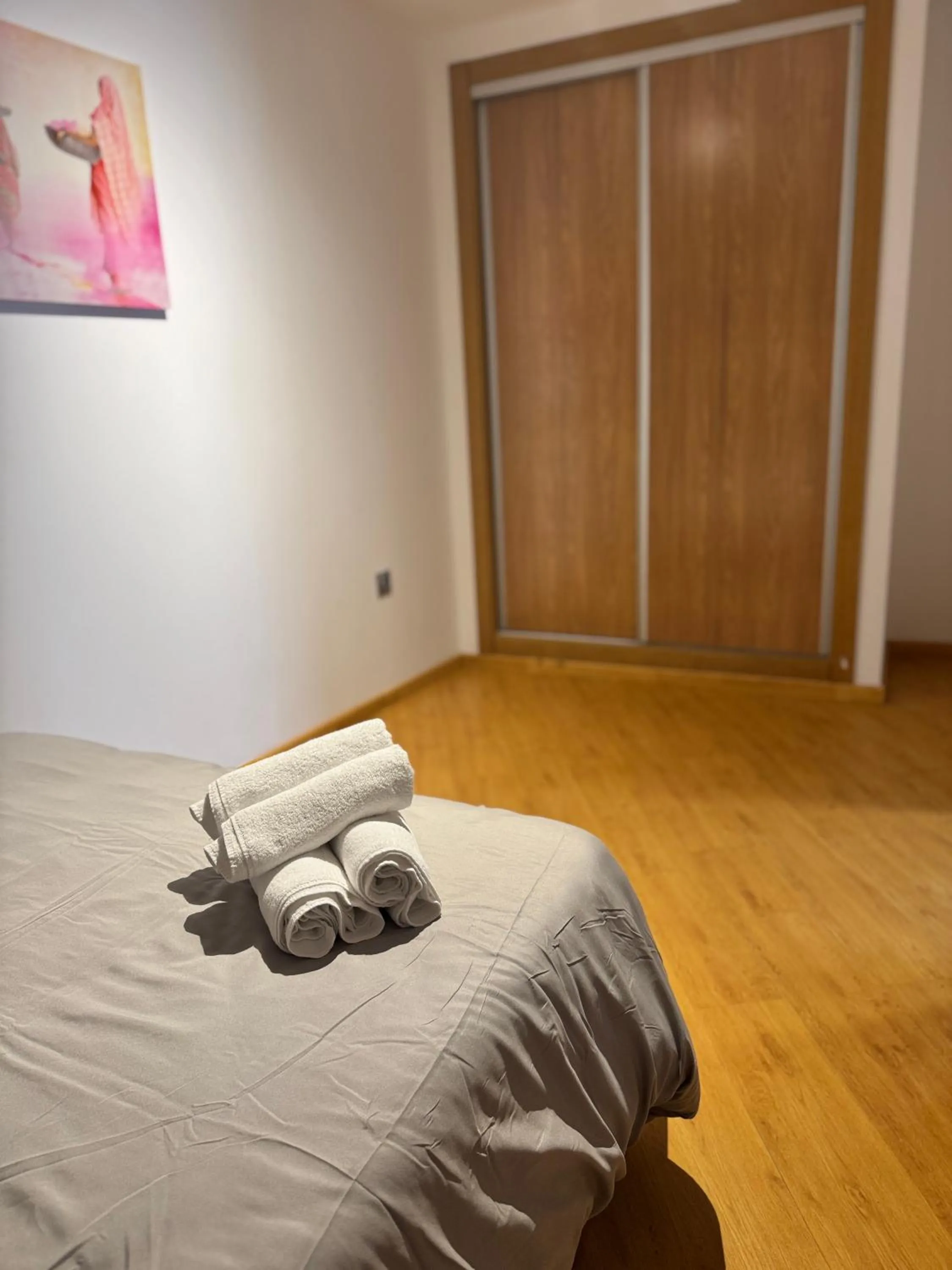 Bed in Wave Apartments