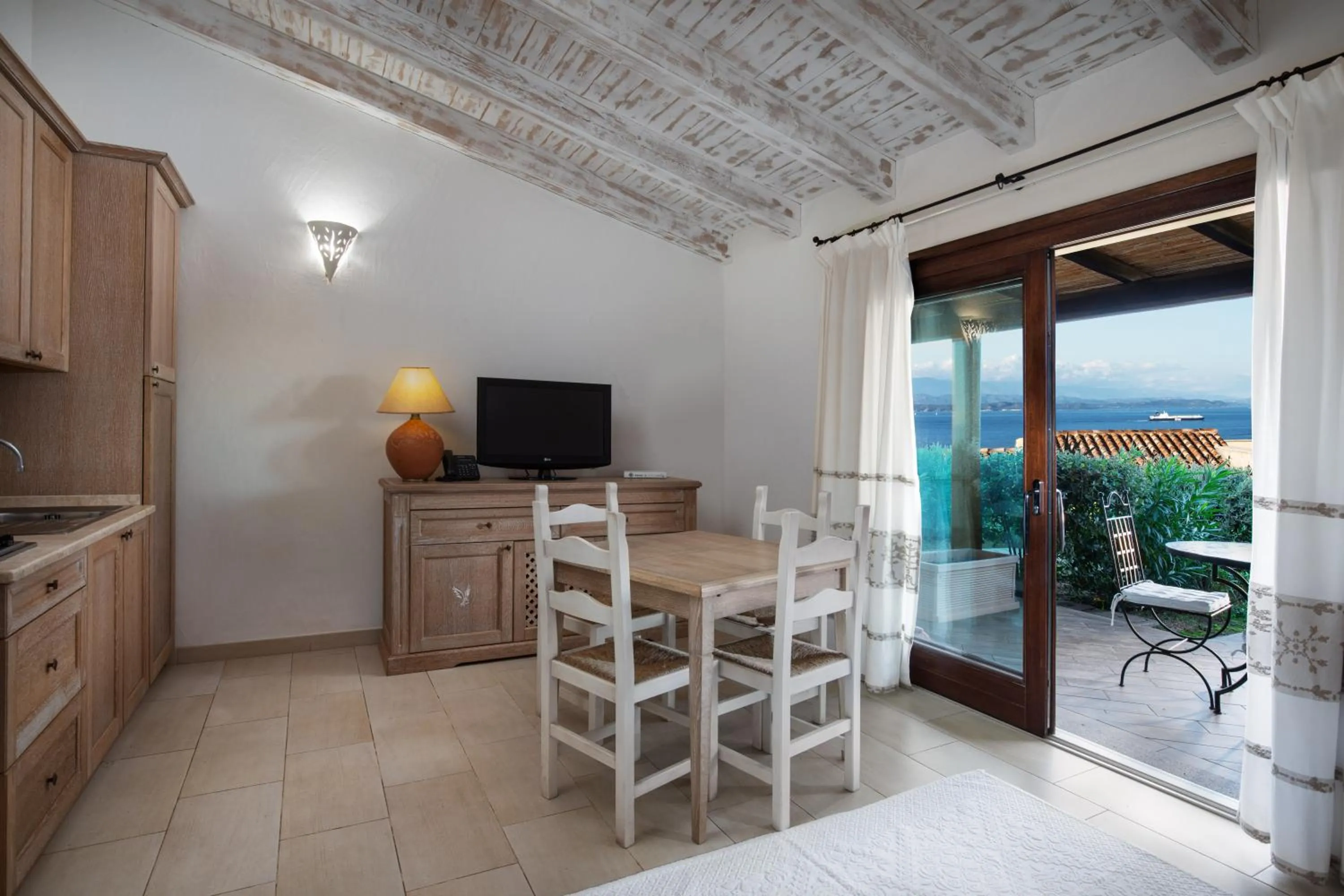 Kitchen or kitchenette in Punta Falcone Resort