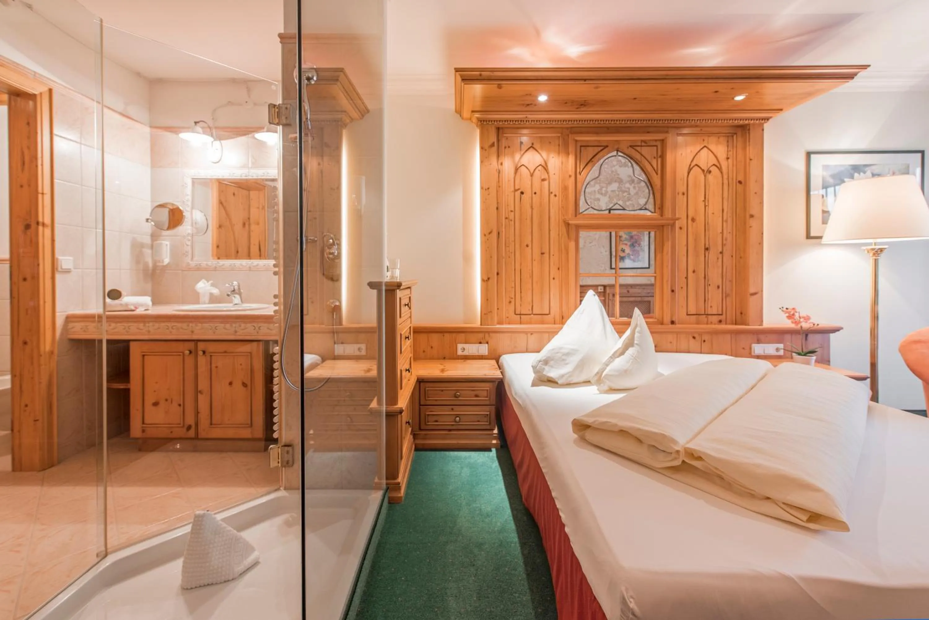 Bathroom, Bed in Hotel Vitalquelle Montafon
