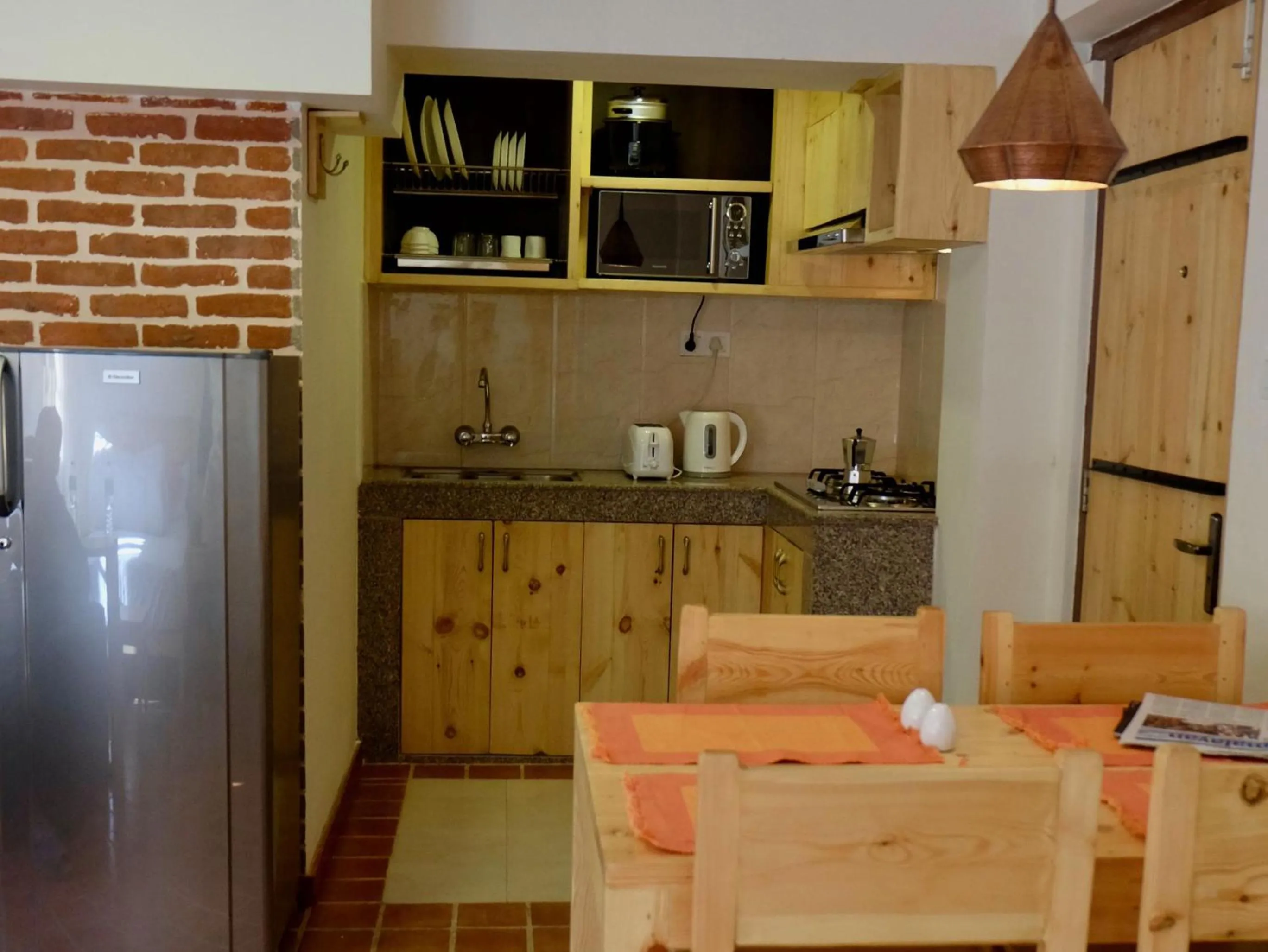Kitchen or kitchenette in Hotel Timila