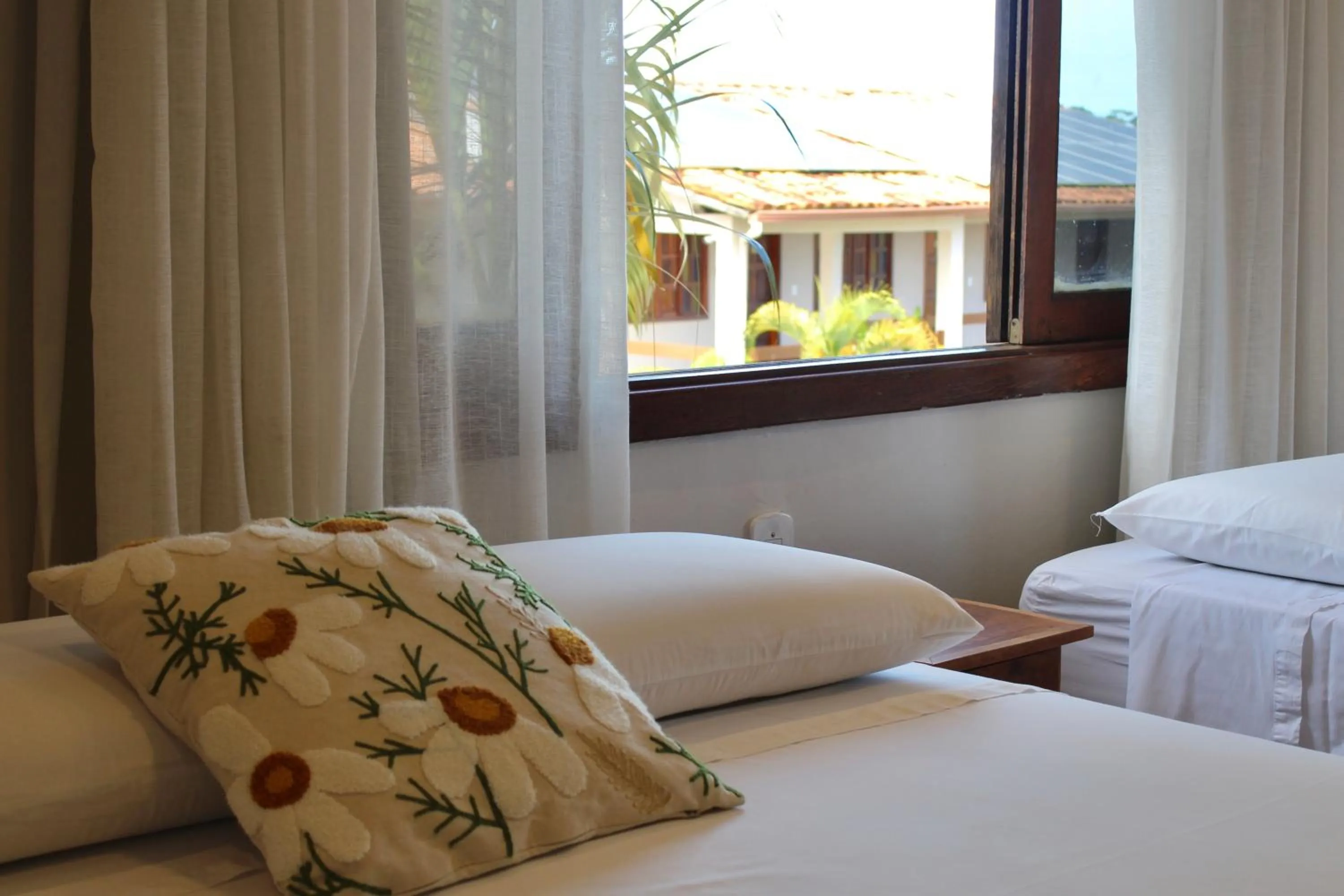 Bed in Pousada Encantos de Arraial