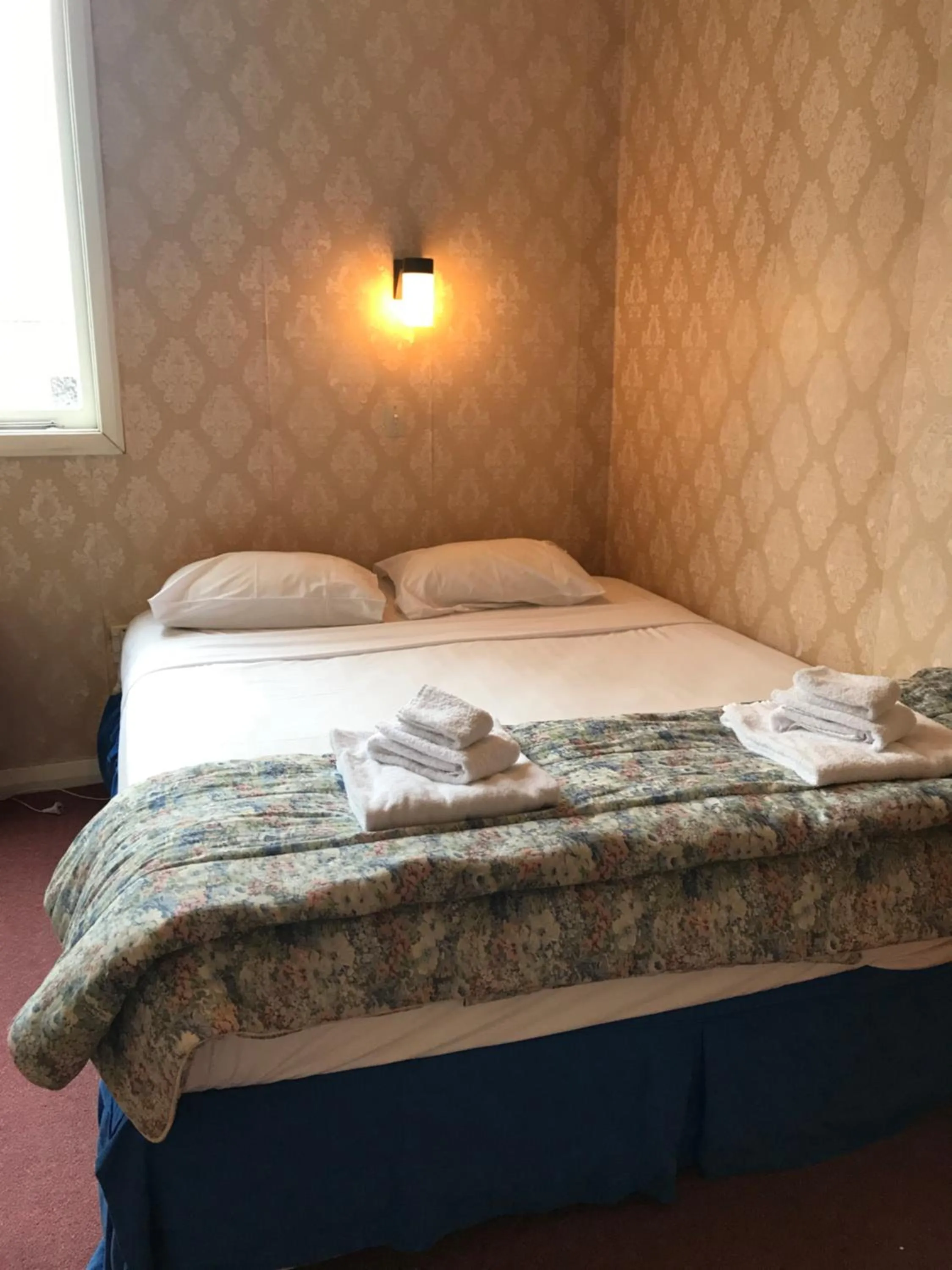 Bed in Criterion Club Hotel