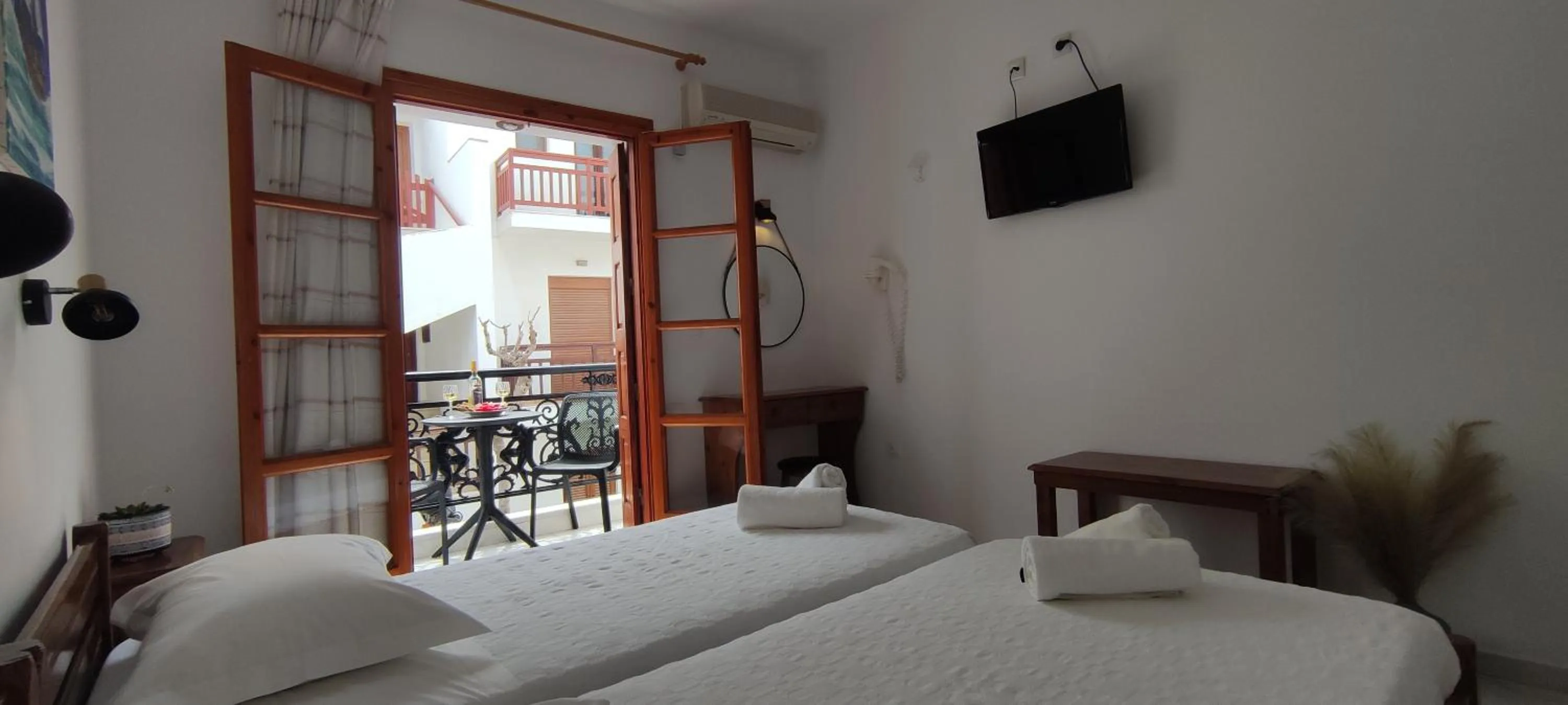 Bed in Kapetanos Rooms